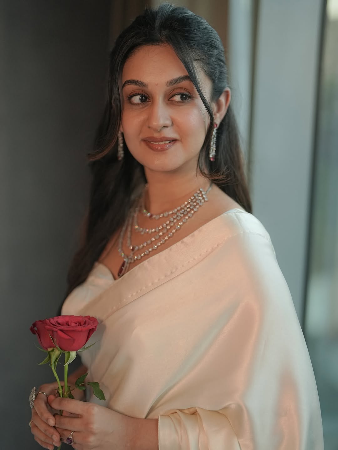 Aishwarya Arjun shines with timeless elegance and playful charm