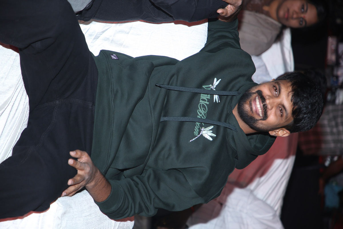 Mahesh Achanta seated and laughing