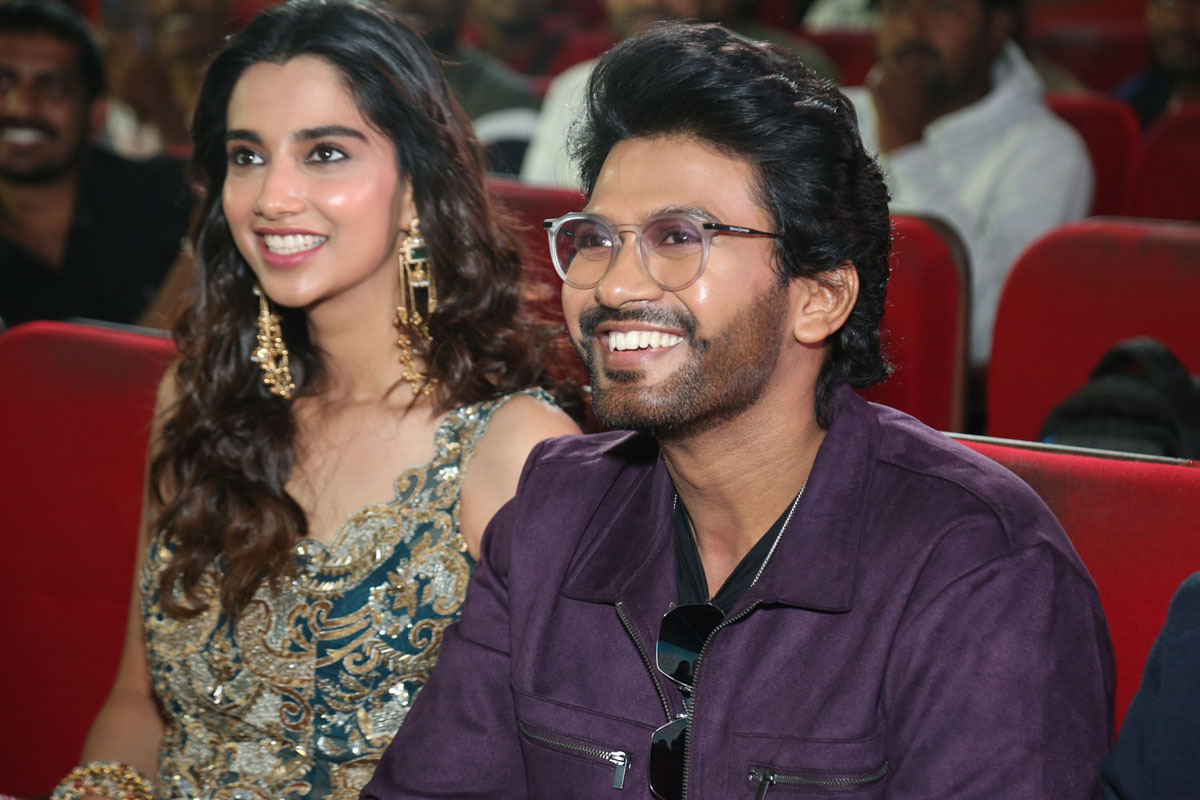 Meenakshi Chaudhary and Naveen Polishetty seated together
