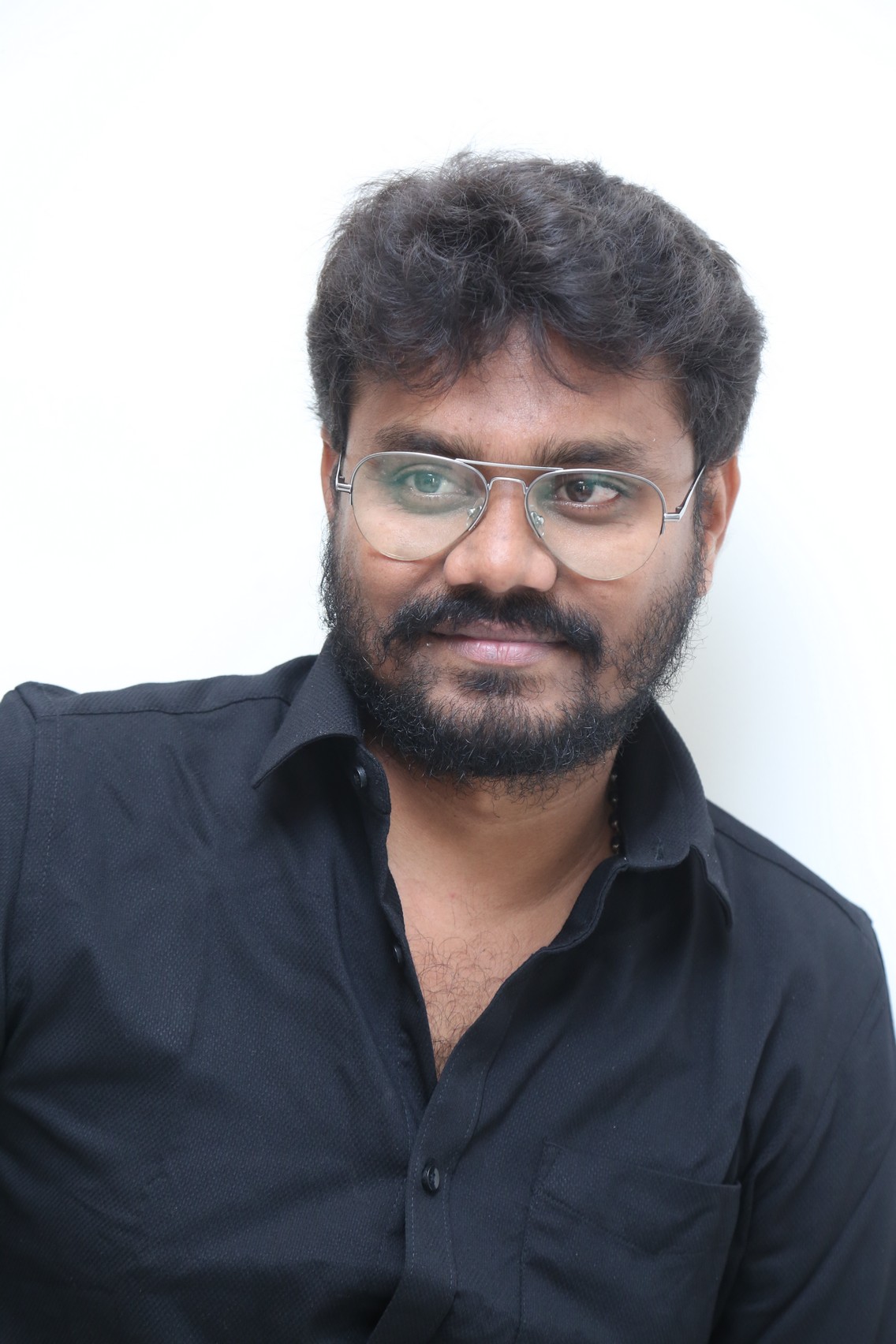 AR Sajeev showcasing minimal black outfit confidence