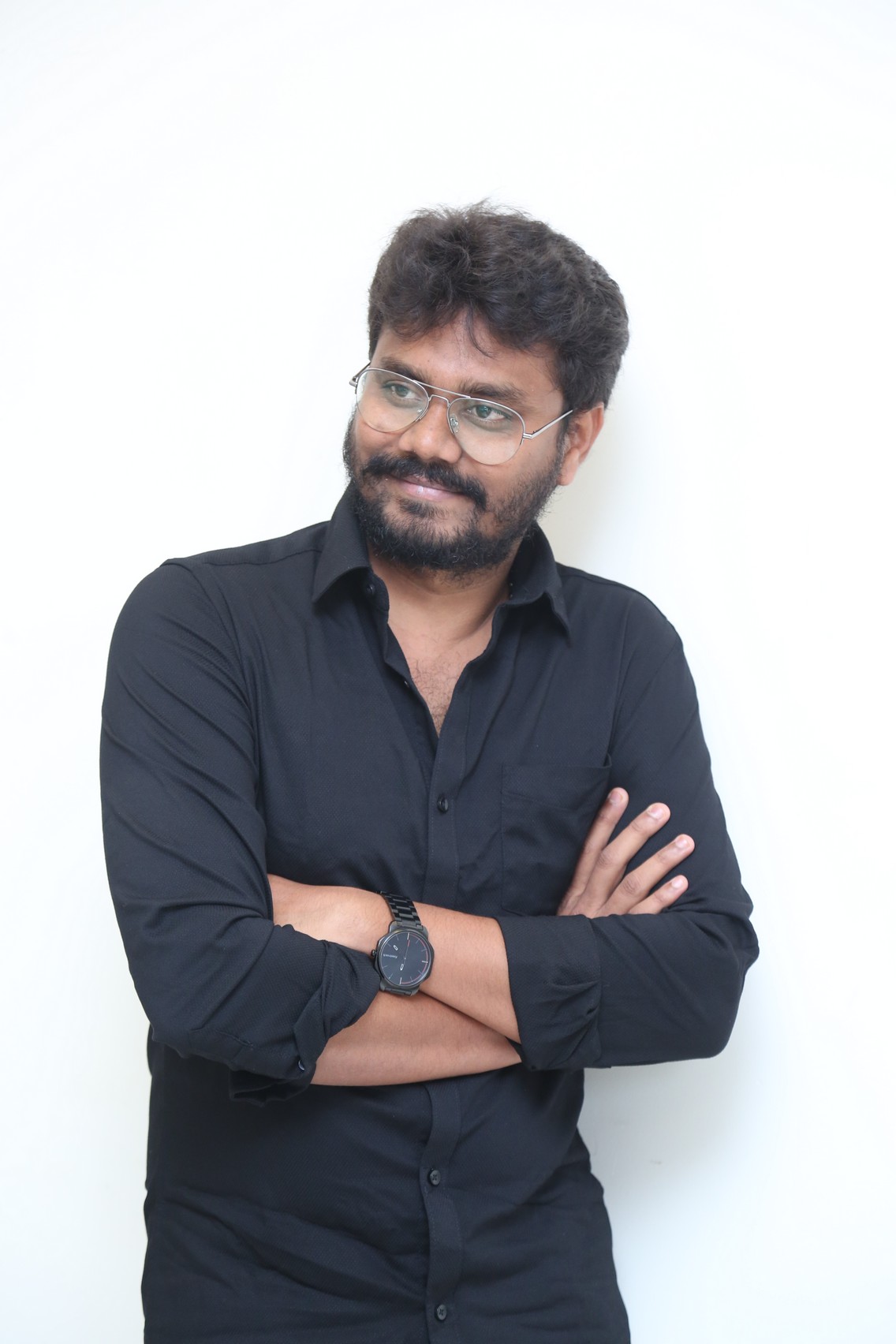 AR Sajeev polished look with stylish glasses