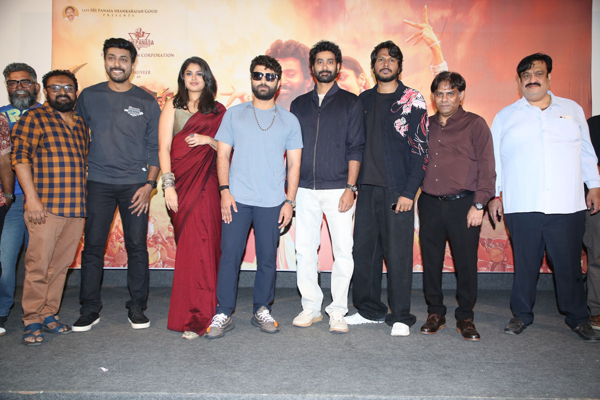 Film team posing together for media