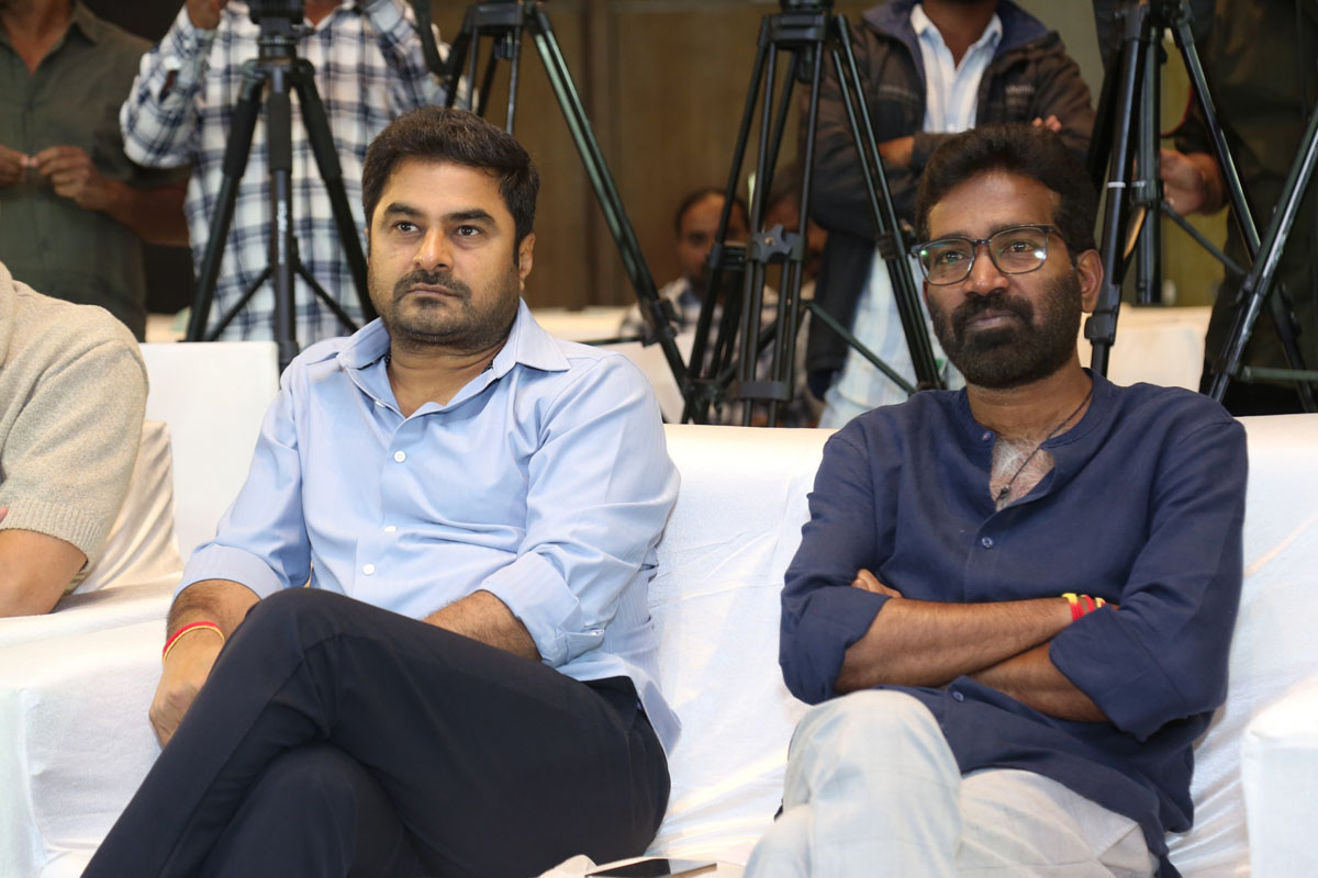 Sudhakar Cherukuri Kishore Tirumala seated on stage