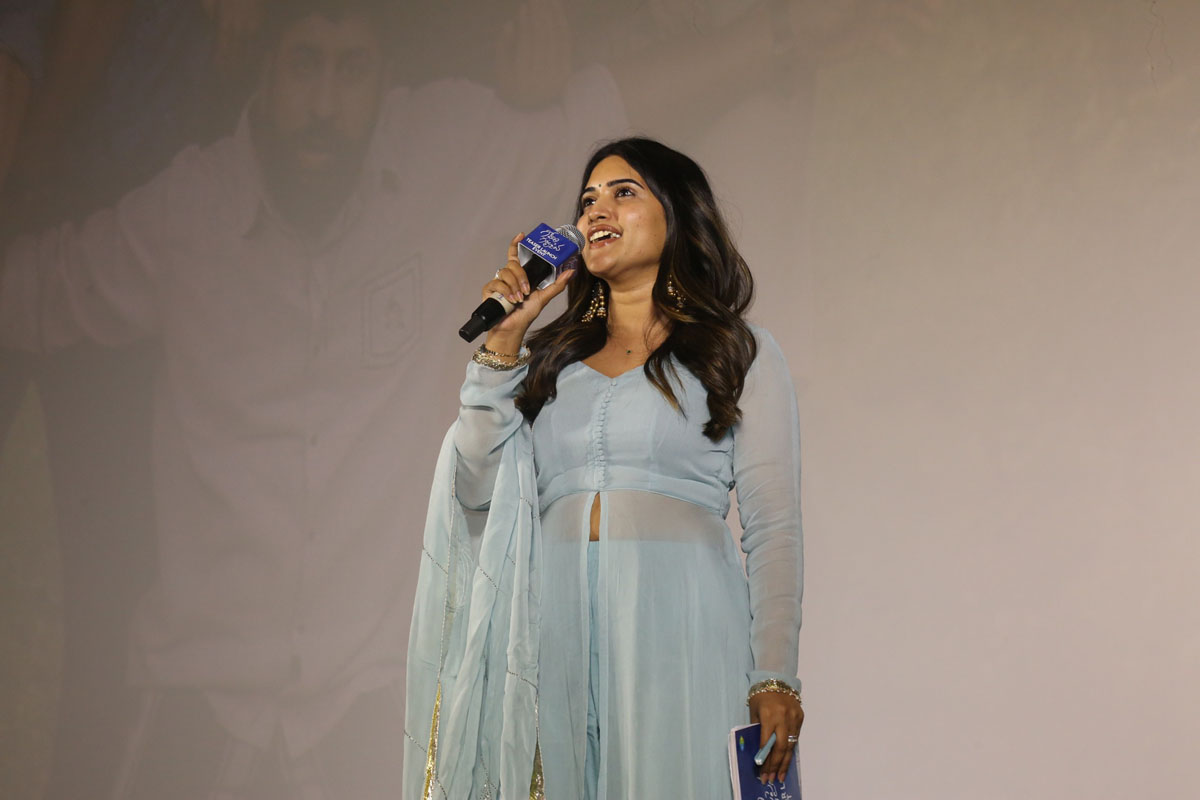 Anchor addressing audience at teaser launch