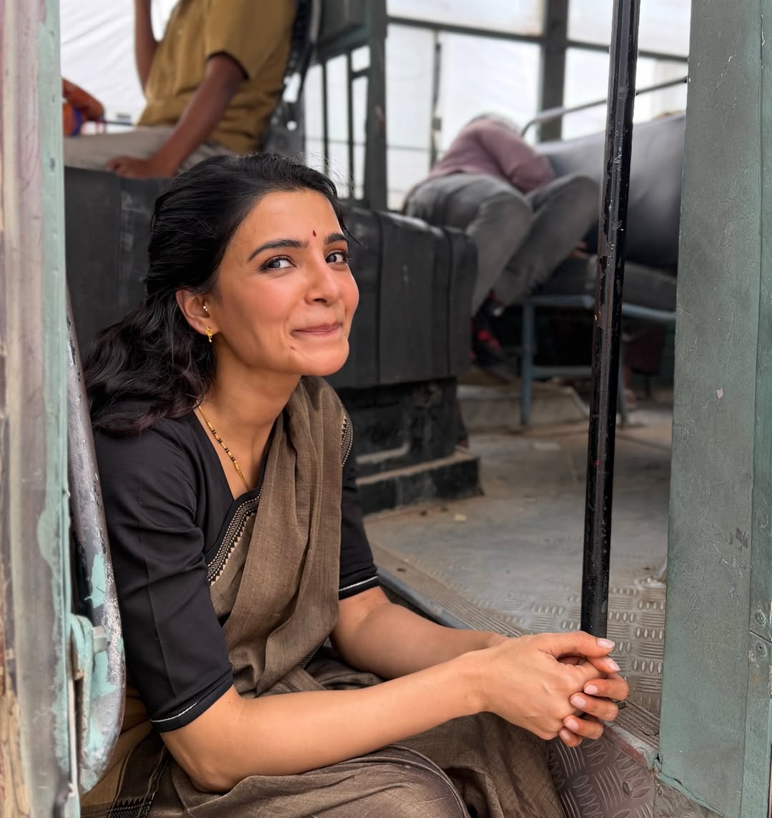 Samantha Ruth Prabhu smiling on bus steps on set
