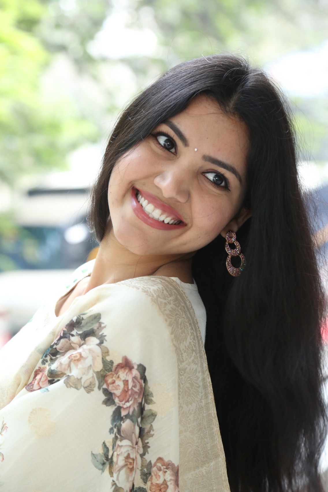 Mounika Reddy smiling brightly in floral traditional look