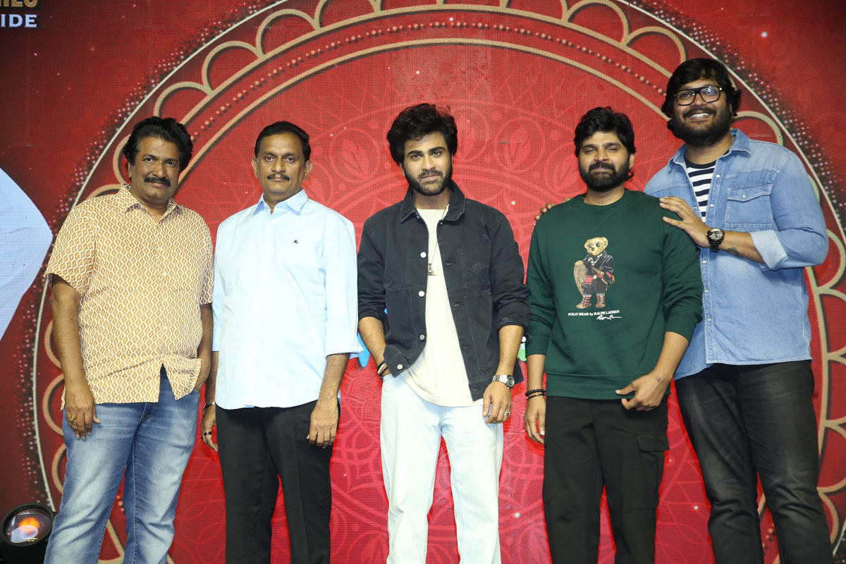 Film team posing together for media photos