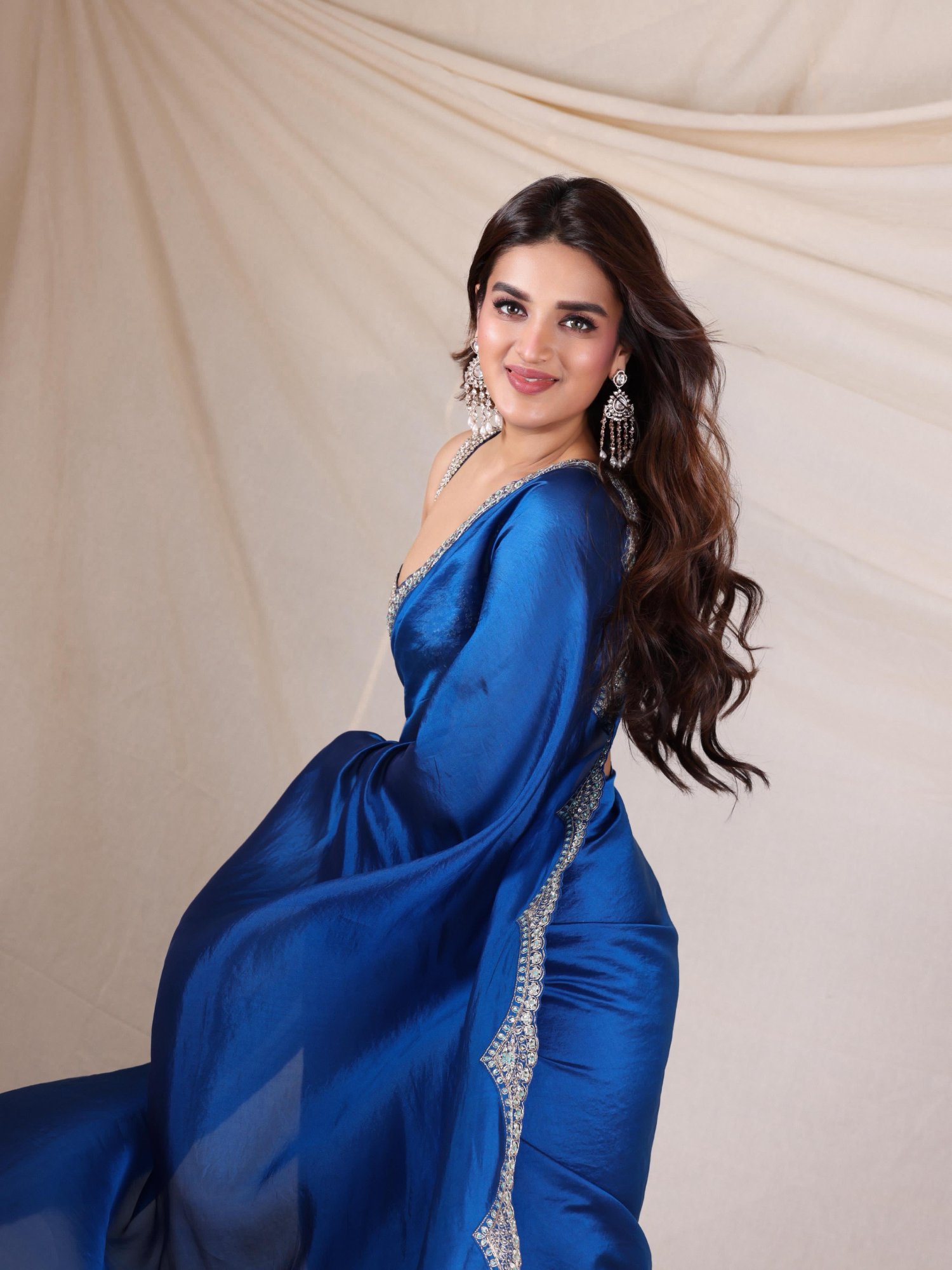 Nidhhi Agerwal stuns in sparkling blue saree