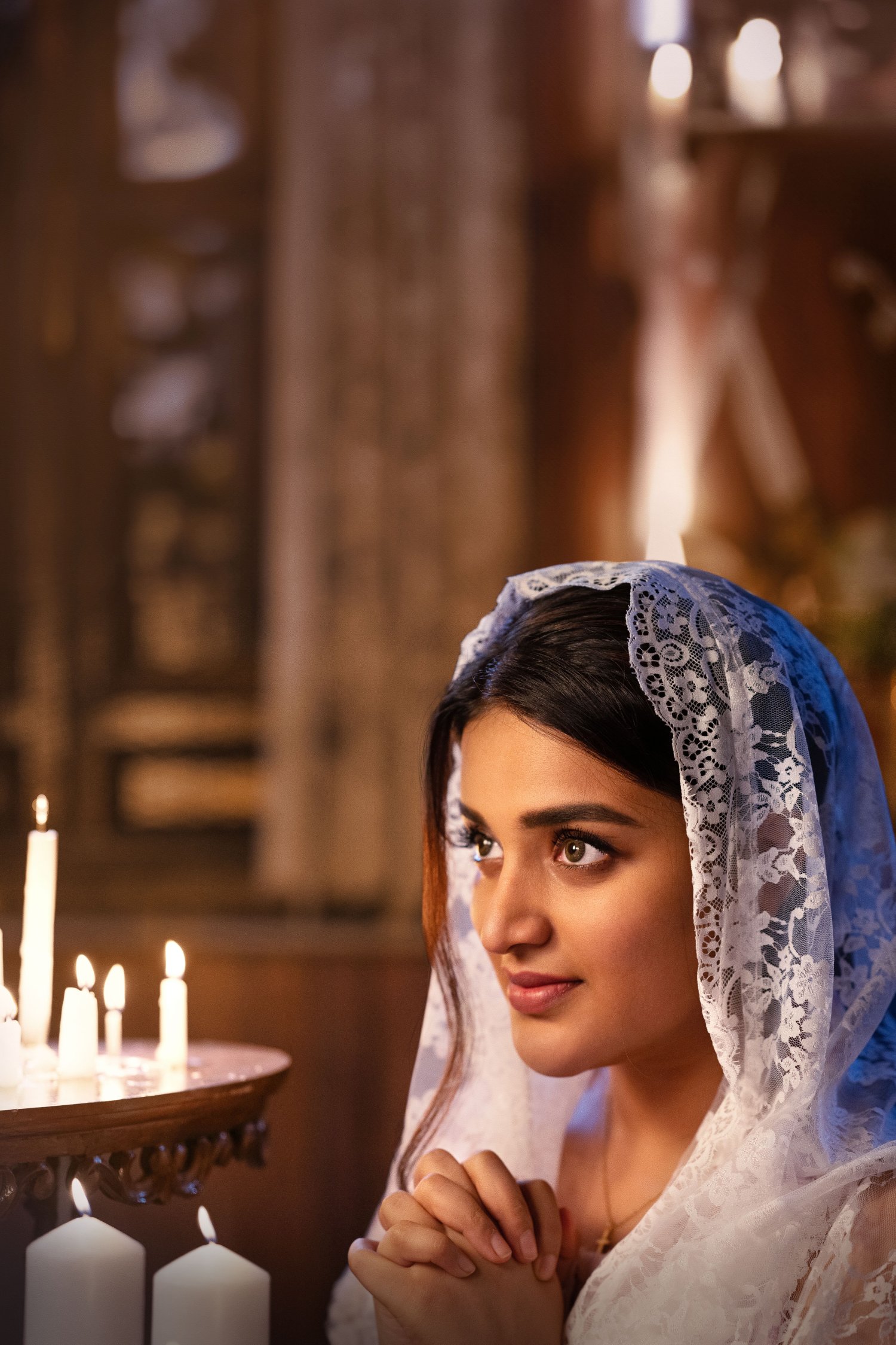 Nidhhi Agerwal glows with serene candlelight elegance