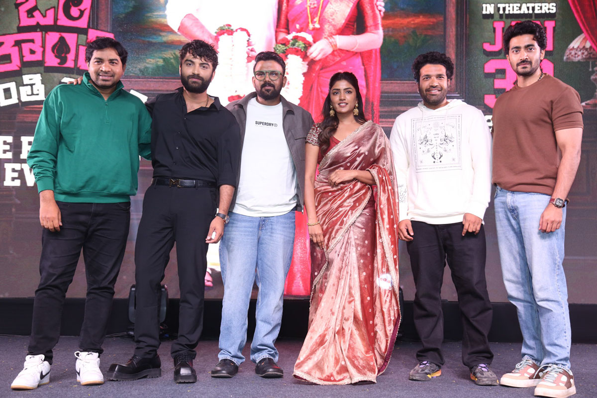 Event cast posing for media together