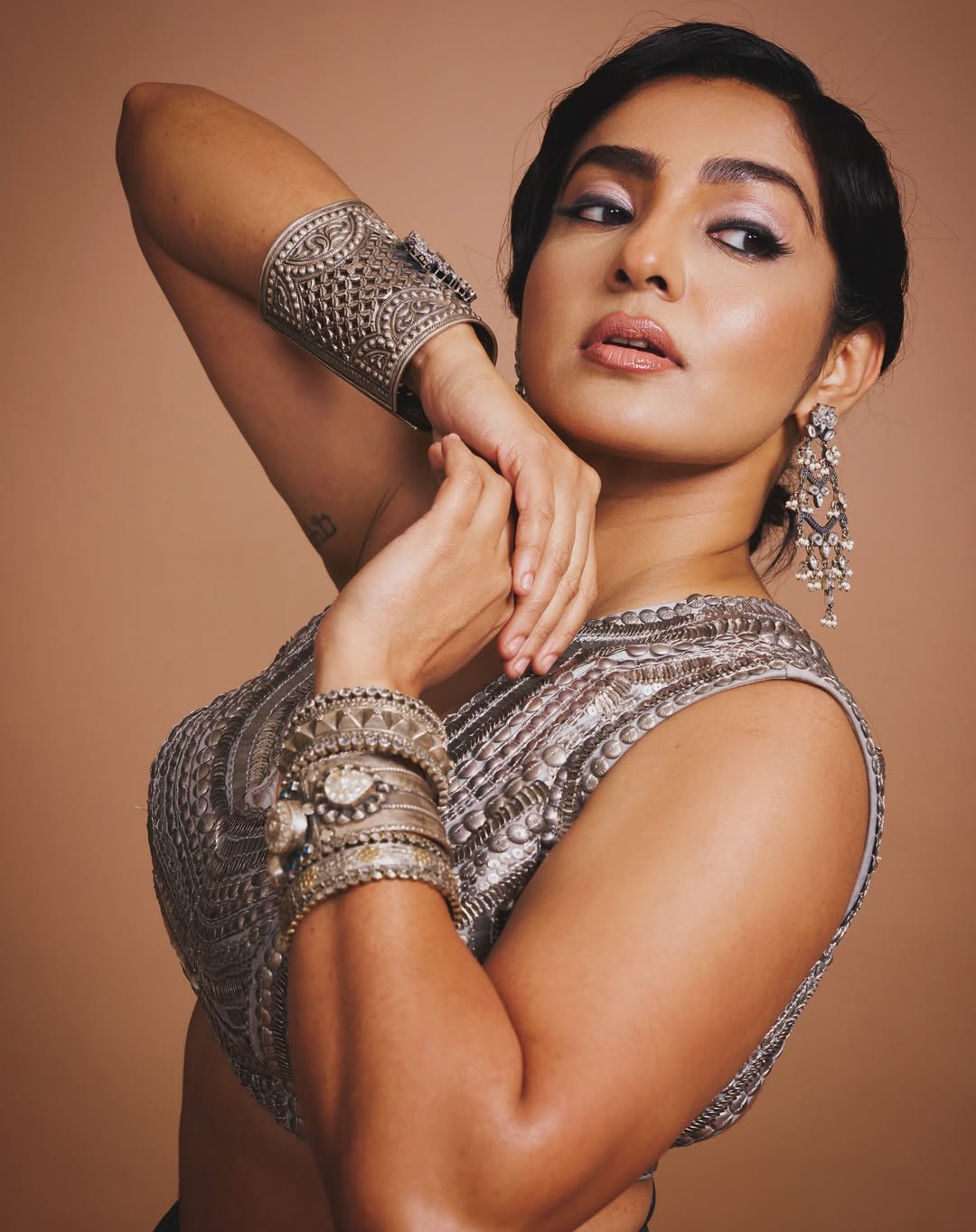 Parvathy Thiruvothu dazzles in radiant metallic glamorous style