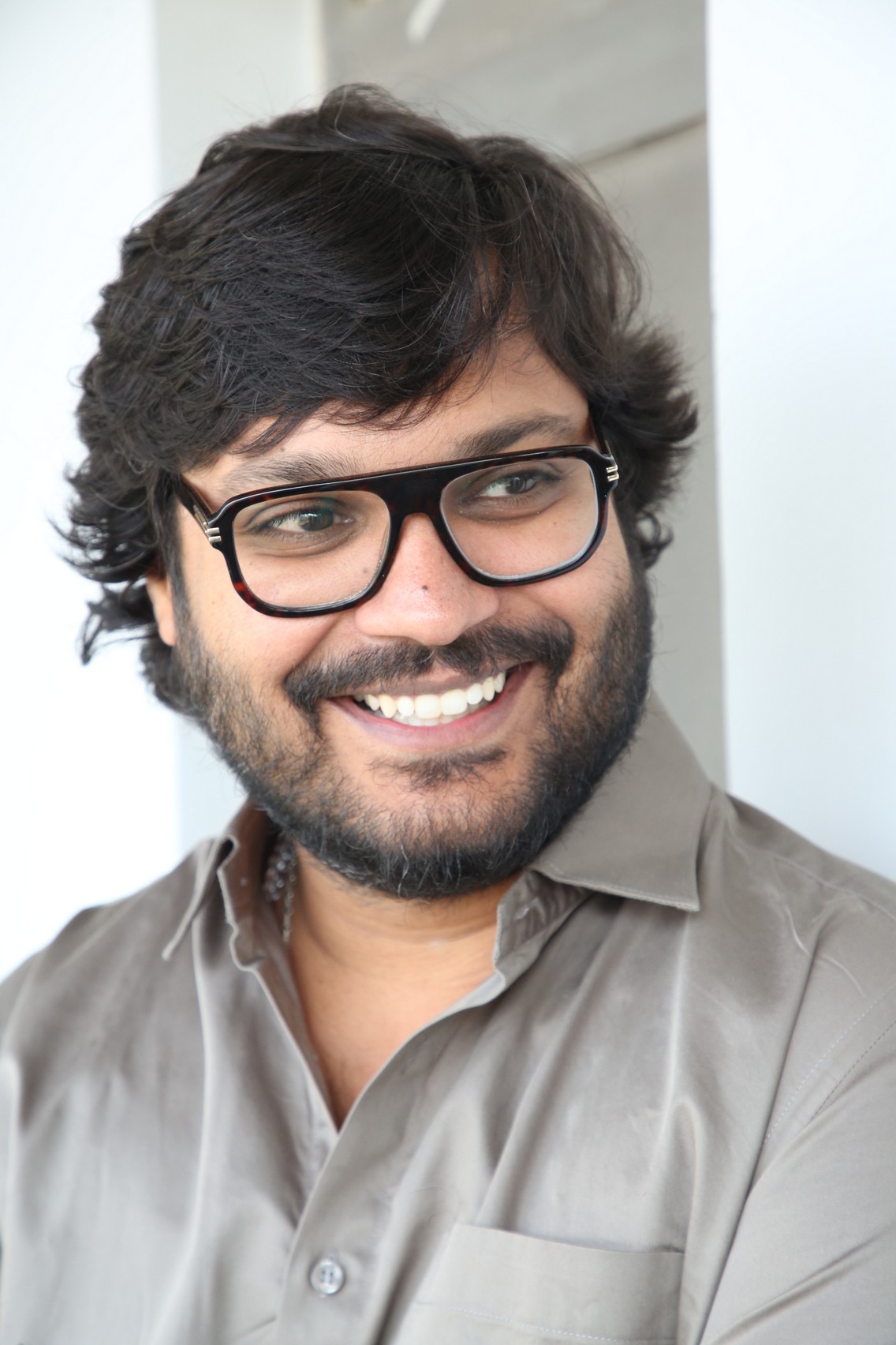 Ram Abbaraju geek chic smiling portrait
