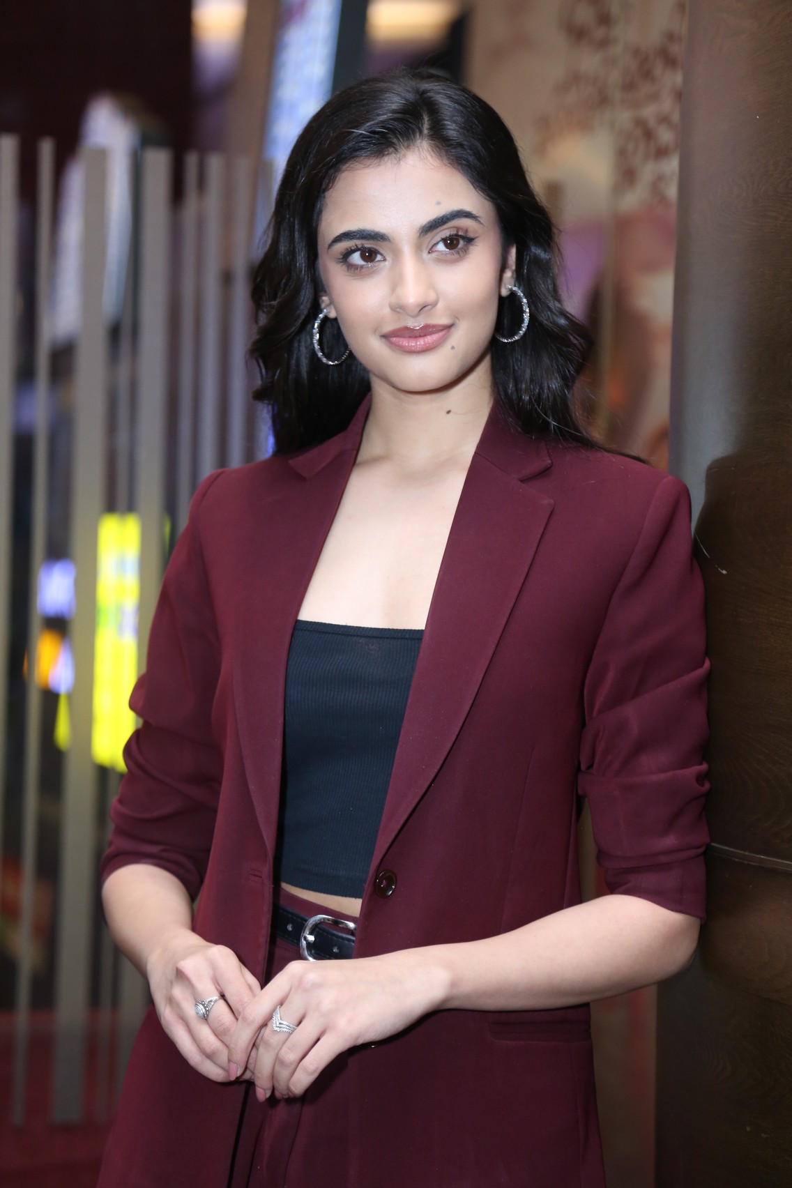 Rhea Singha showcasing chic maroon blazer with confidence