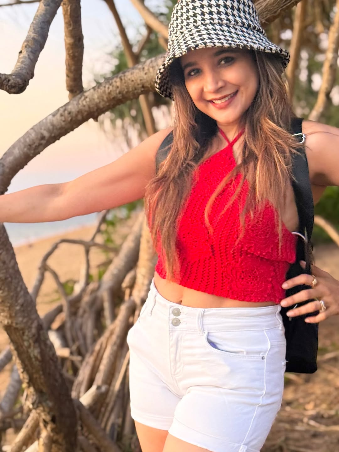 Sakshi flaunts vibrant red crop top beach look