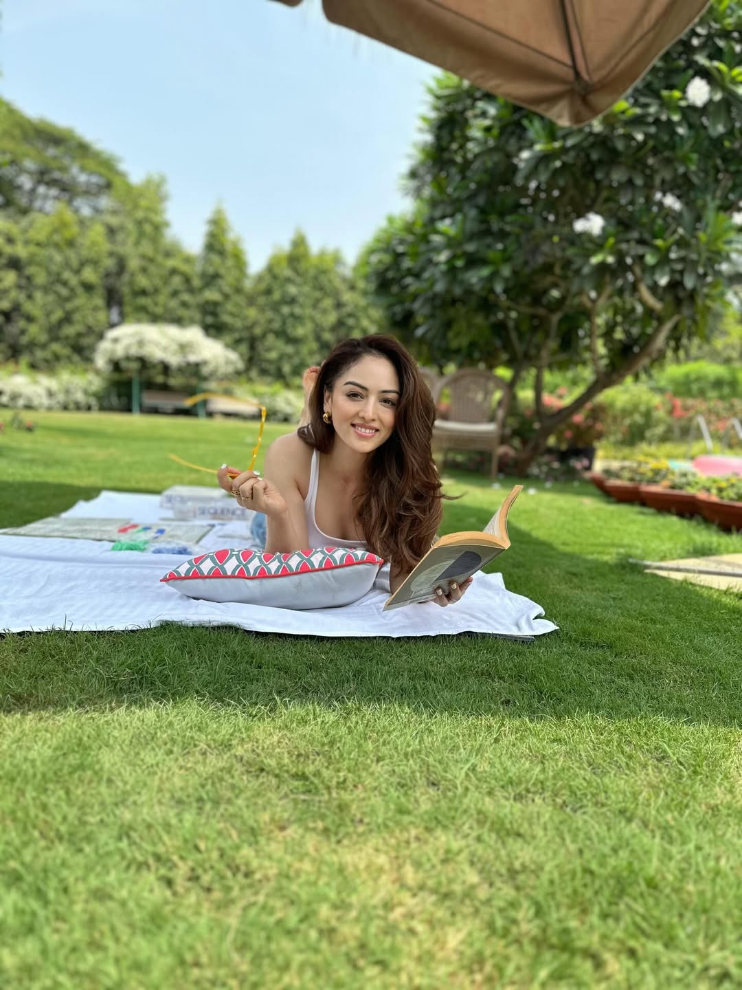 Sandeepa Dhar relaxes with book and sunshine charm