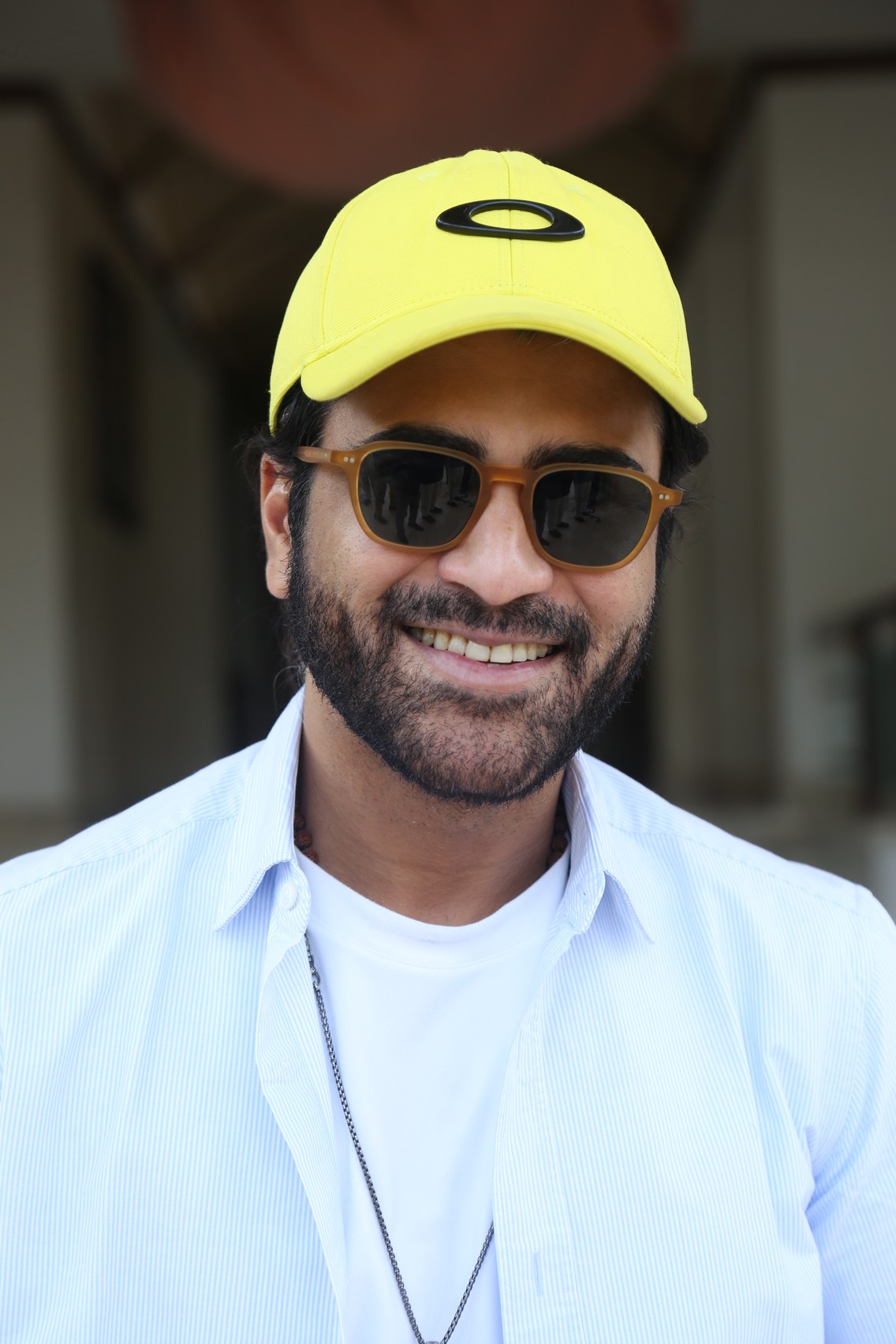 Sharwanand showing sporty charm with cap and shades