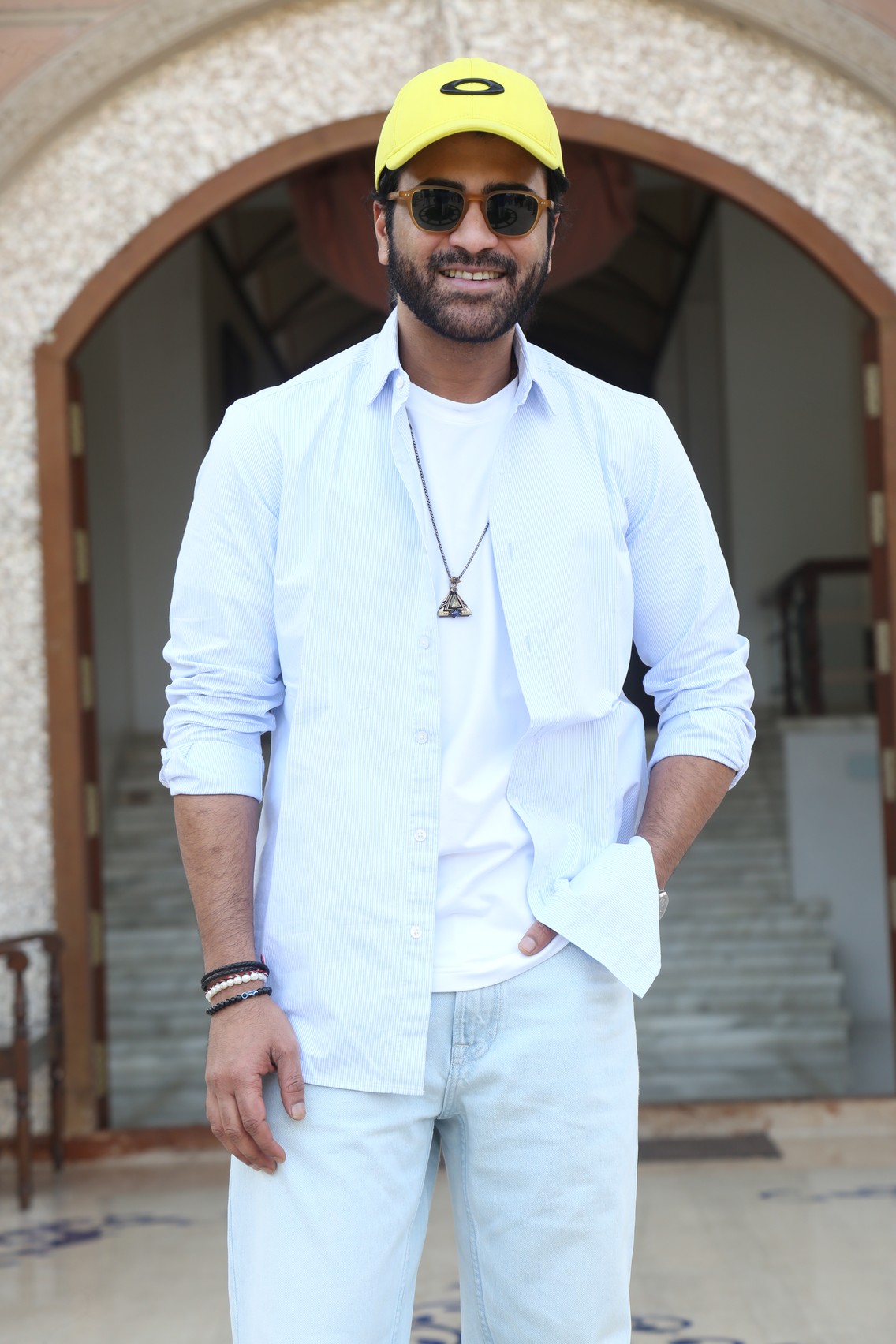 Sharwanand elevating casual white look with yellow cap