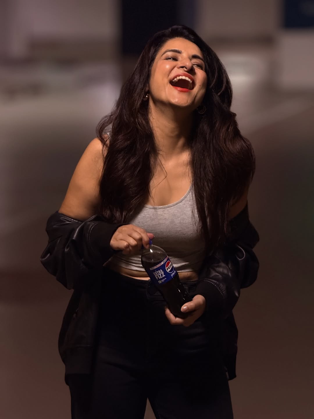 Simple Kaul laughing effortlessly in casual chic