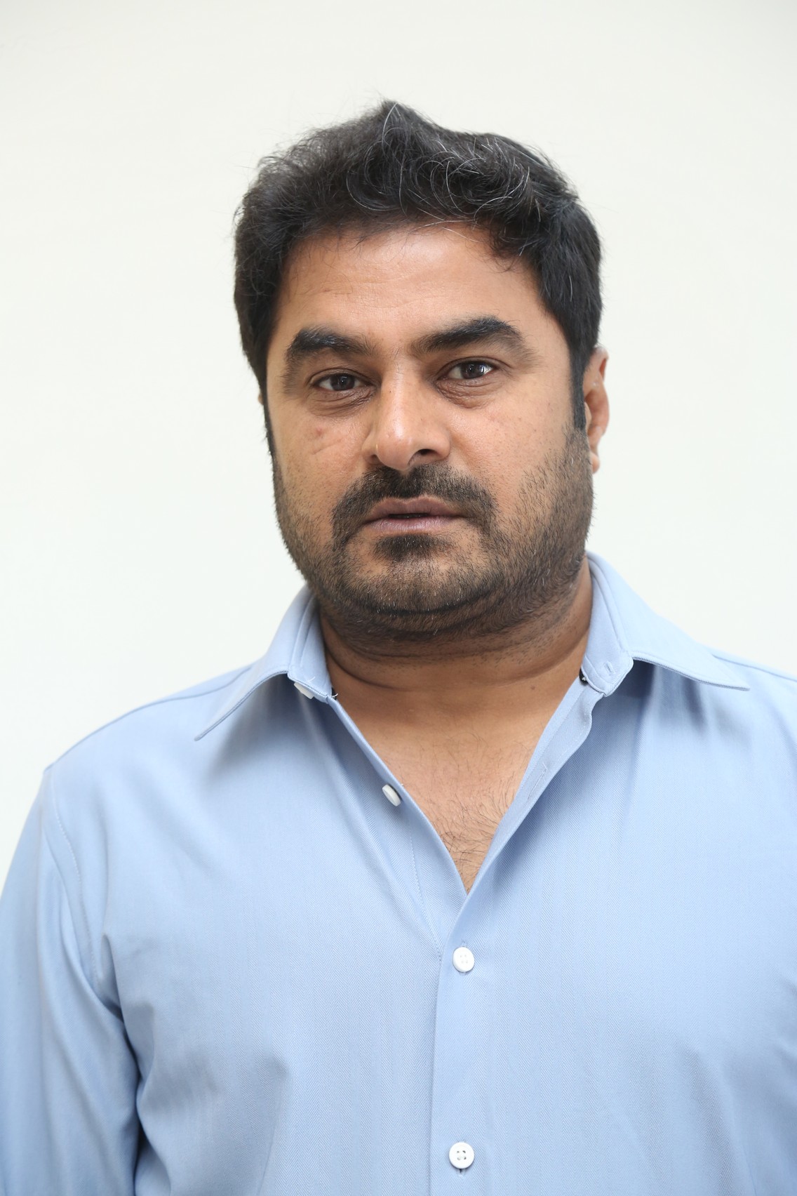 Sudhakar Cherukuri in formal shirt at public event