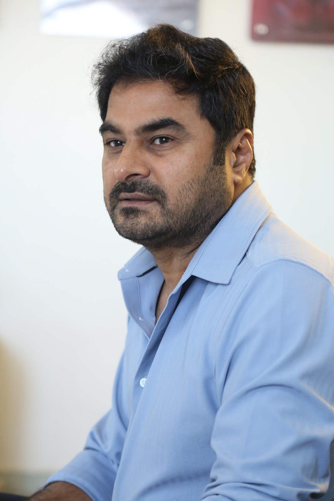 Sudhakar Cherukuri in business casual professional look