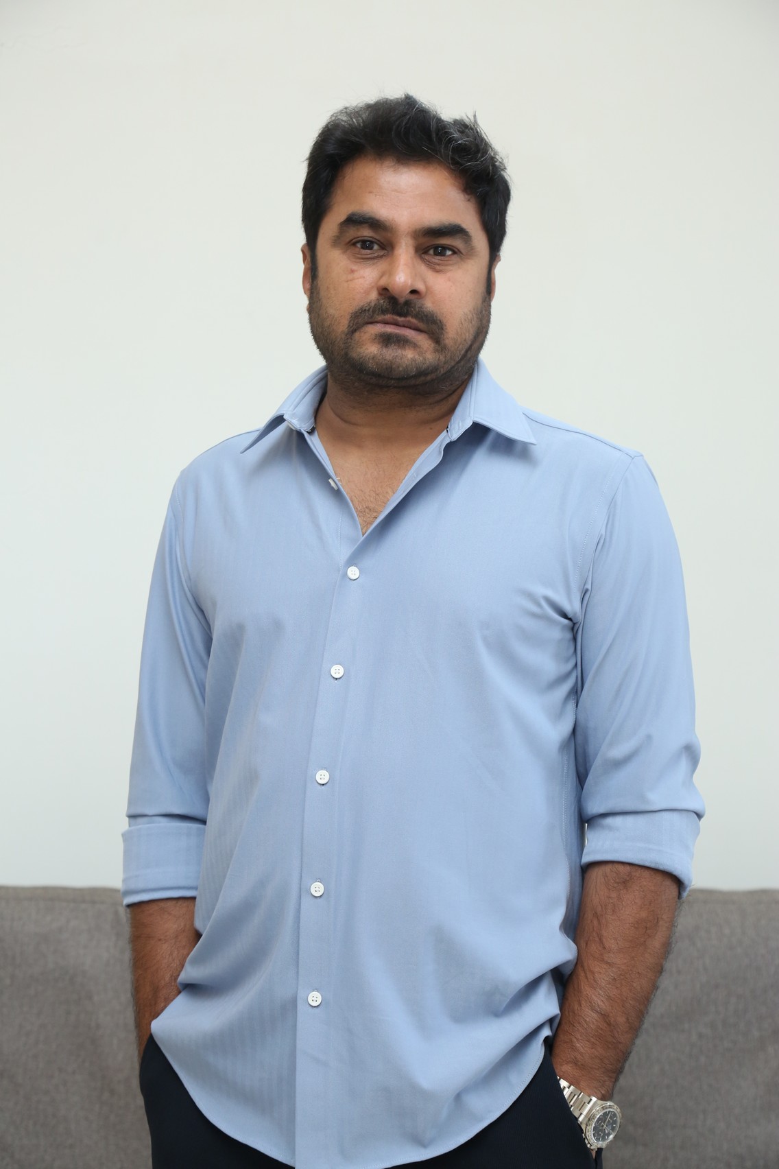 Sudhakar Cherukuri business casual look with rolled sleeves