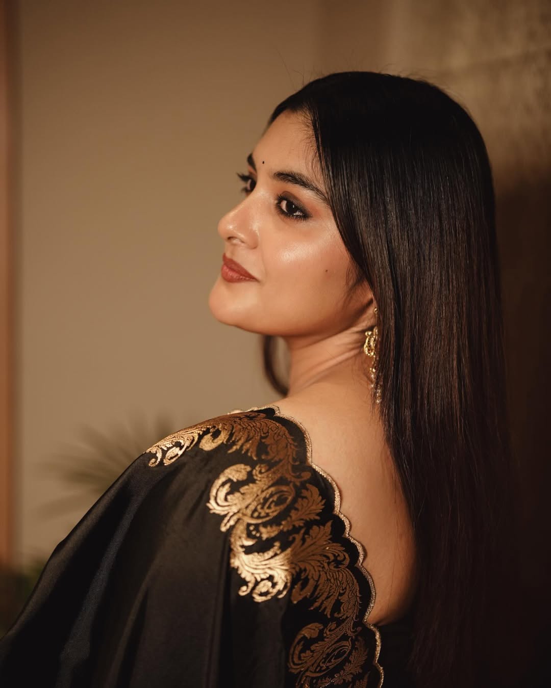 Nivetha Thomas regal gold embellished look