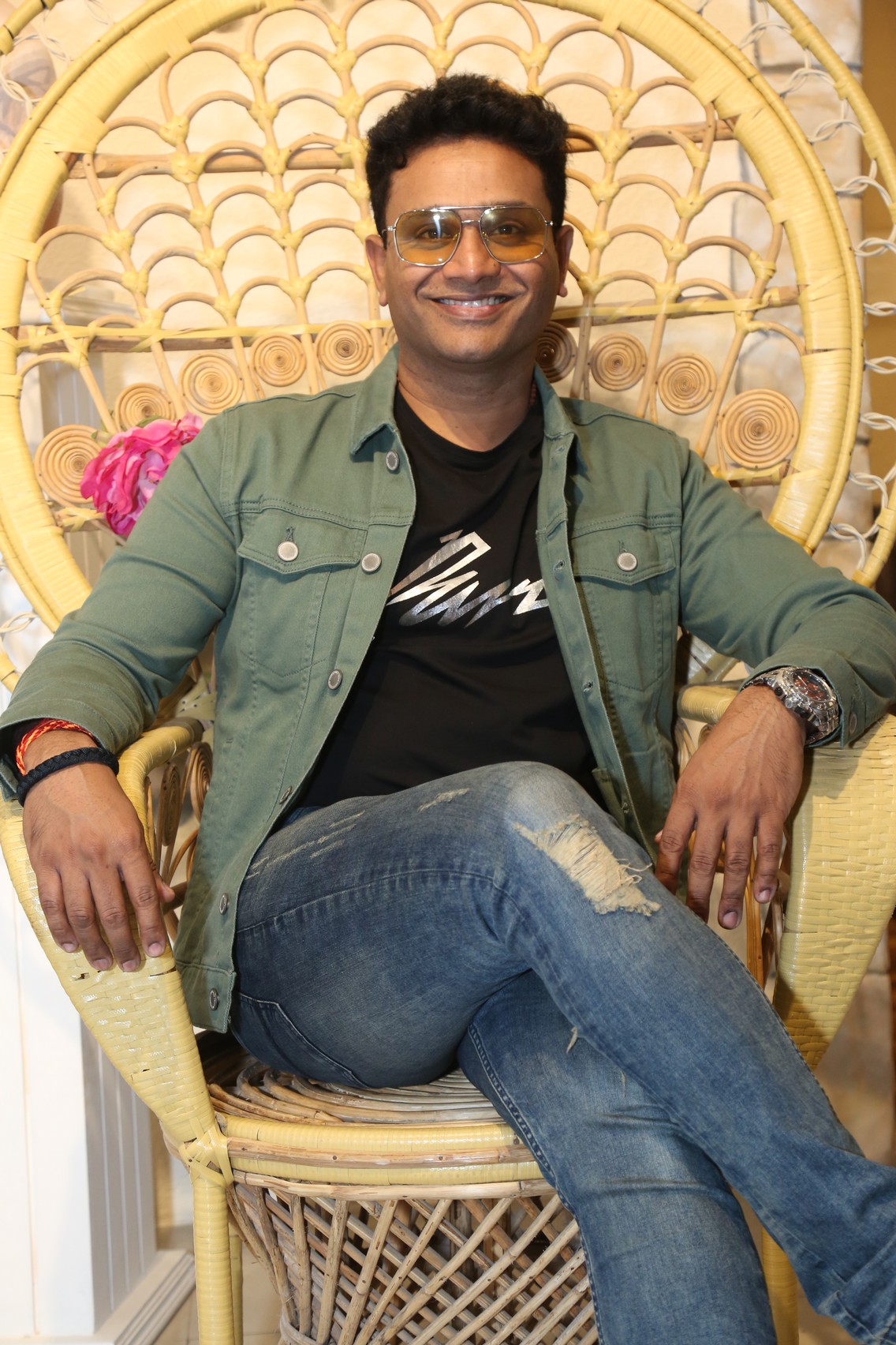 Thaksh seated pose at press event