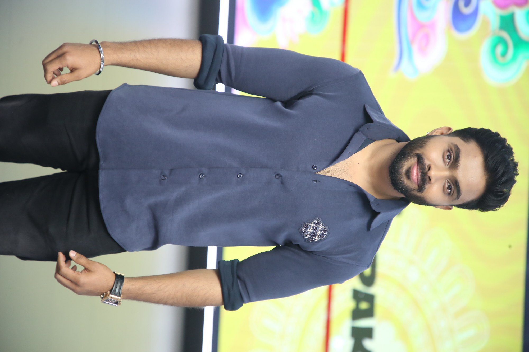 Actor posing solo for media cameras