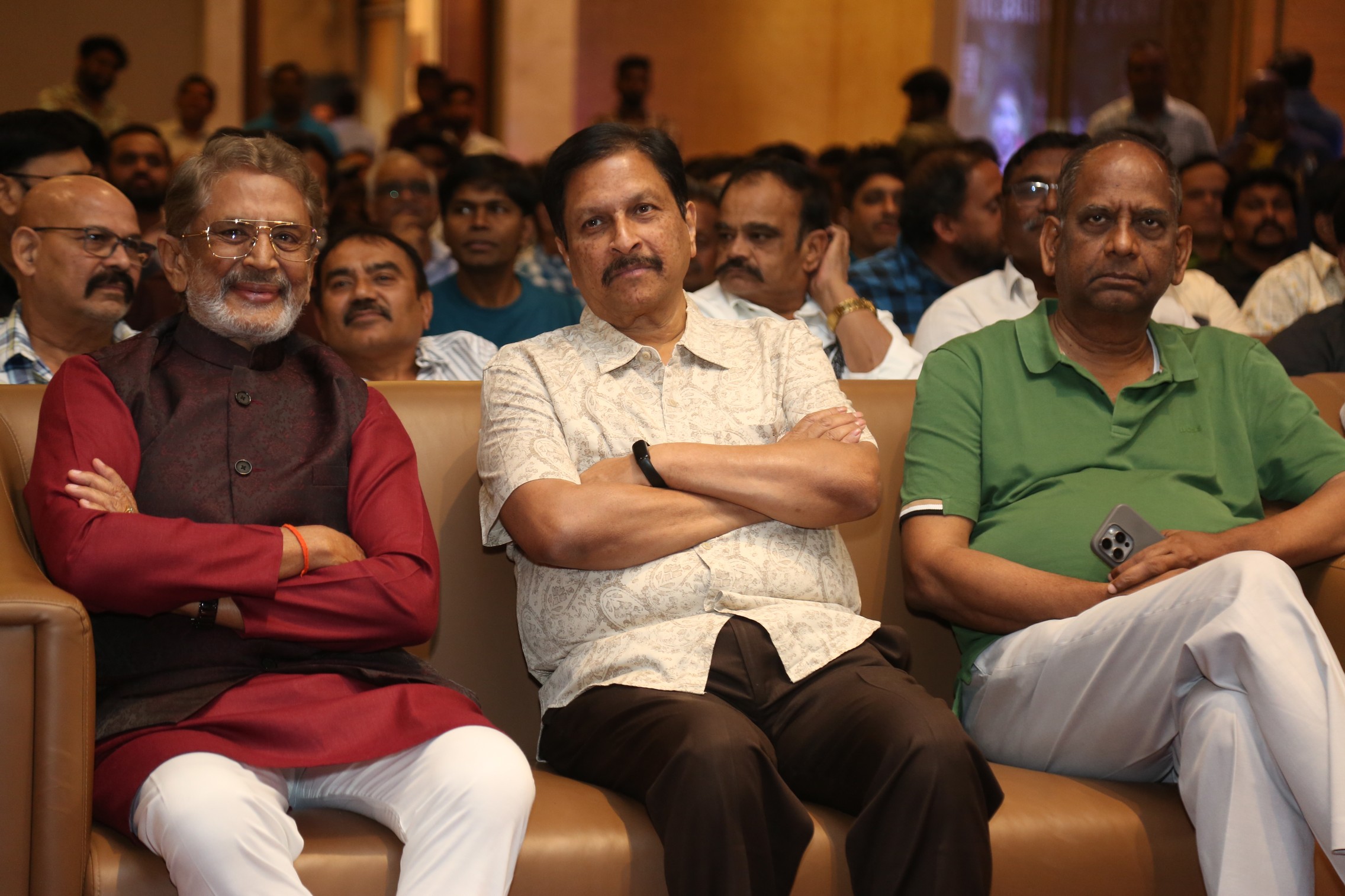 Film team posing together on stage