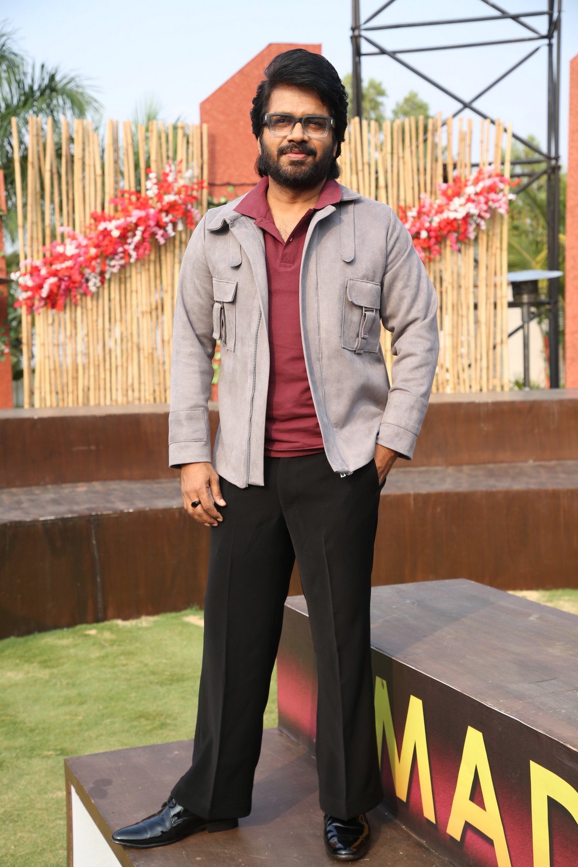 Anil Ravipudi stylish pose casual elegance