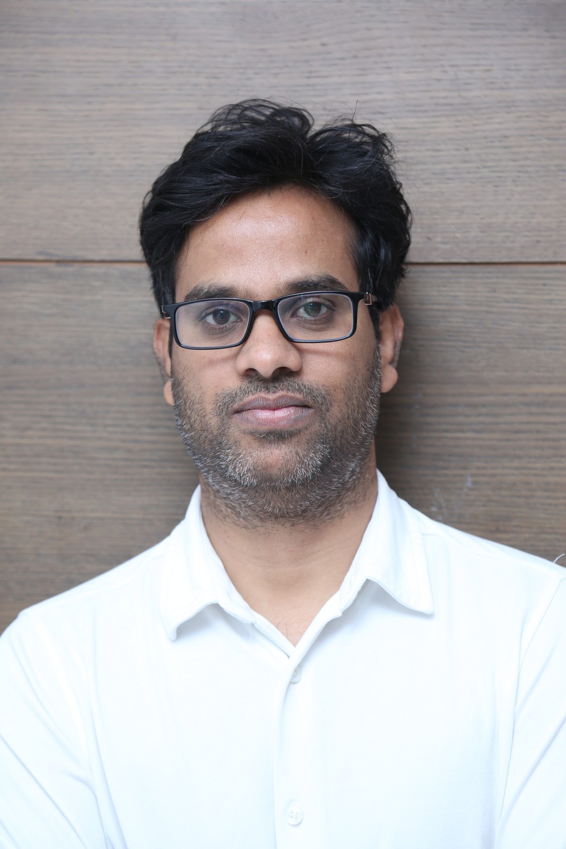 Anudeep KV in sharp suit portrait