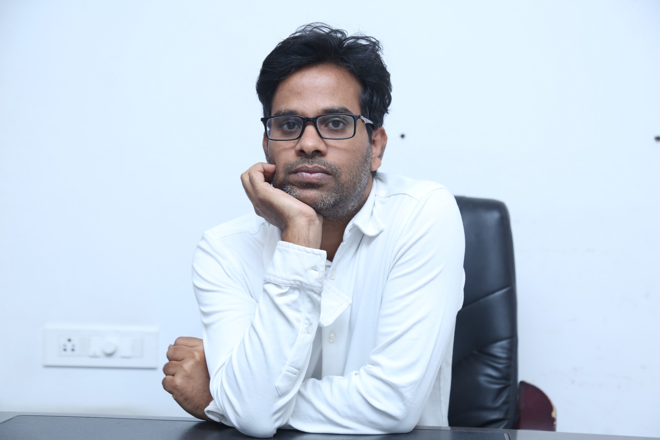 Anudeep KV crisp white shirt portrait