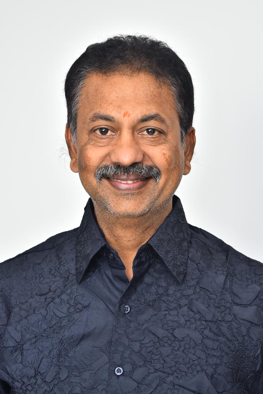 Chinta Gopalakrishna Reddy in sharp suit smiling confidently