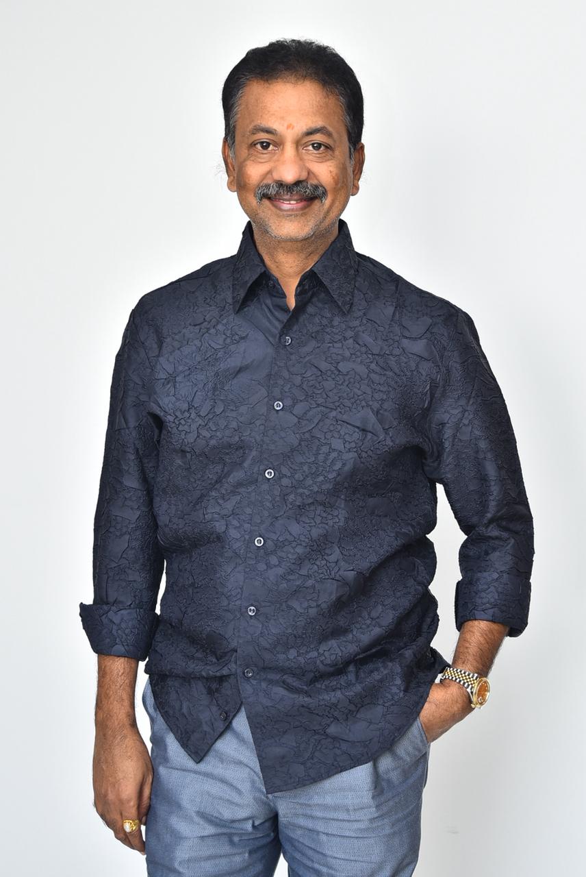 Chinta Gopalakrishna Reddy navy shirt confident smiling look