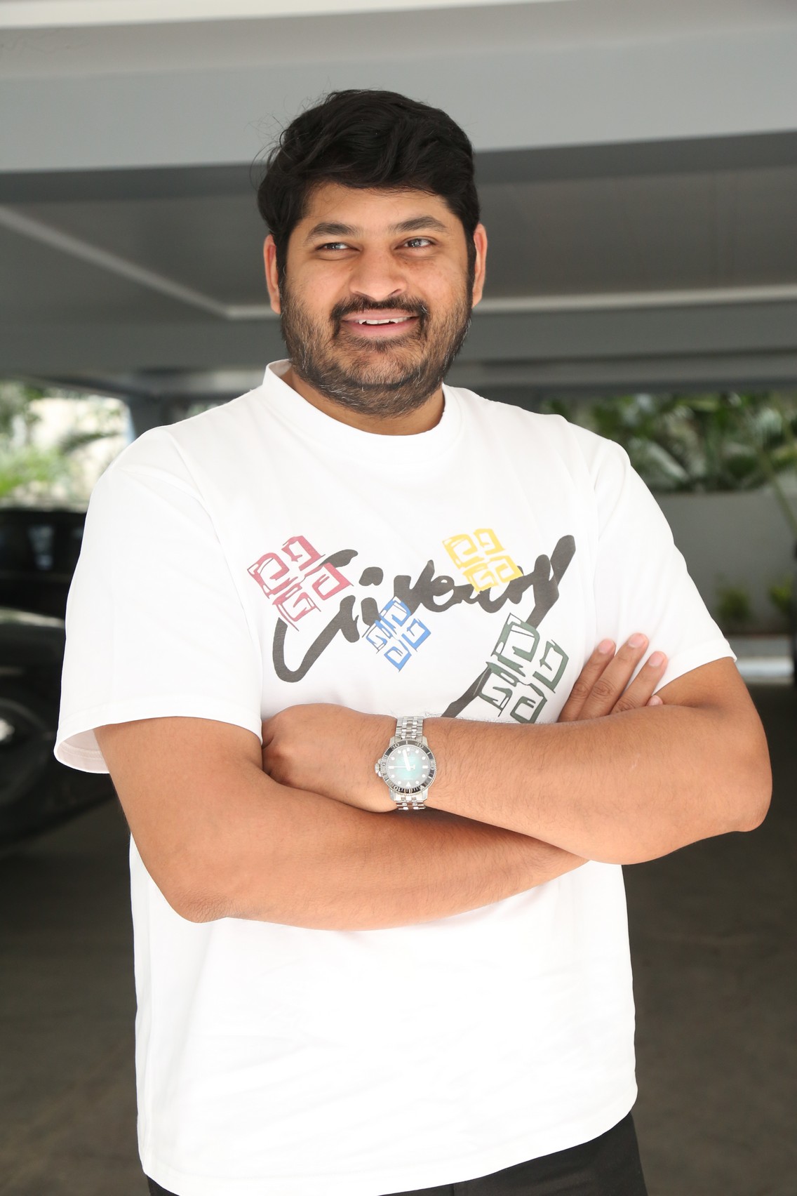 Dheeraj Mogilineni colorful casual pose smiling