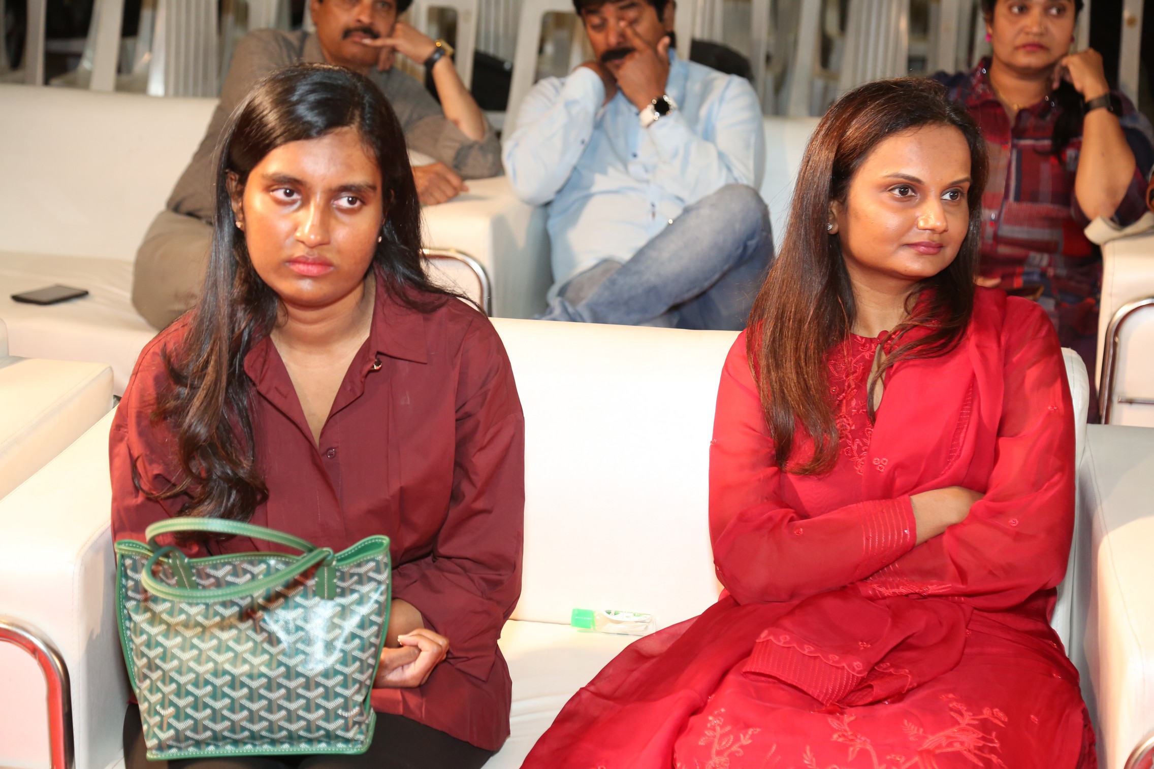 Producer Neelima Guna seated on stage