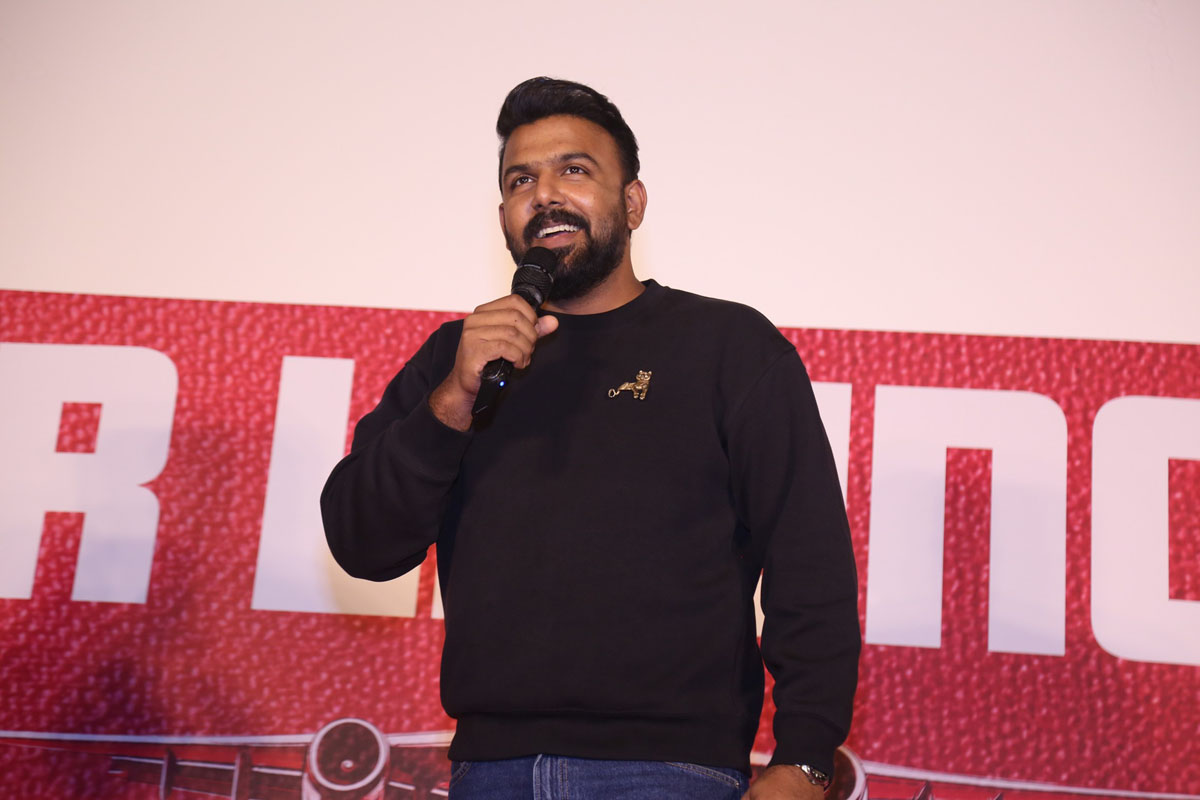 Tharun Bhascker speaking on stage at film function