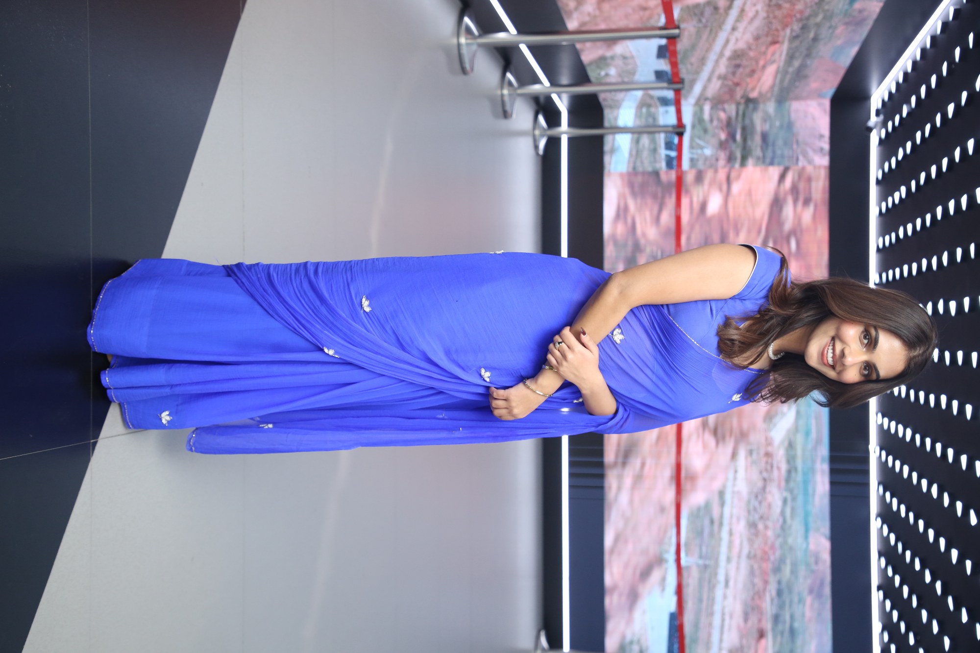 Gopika Suresh smiling beautifully in blue attire