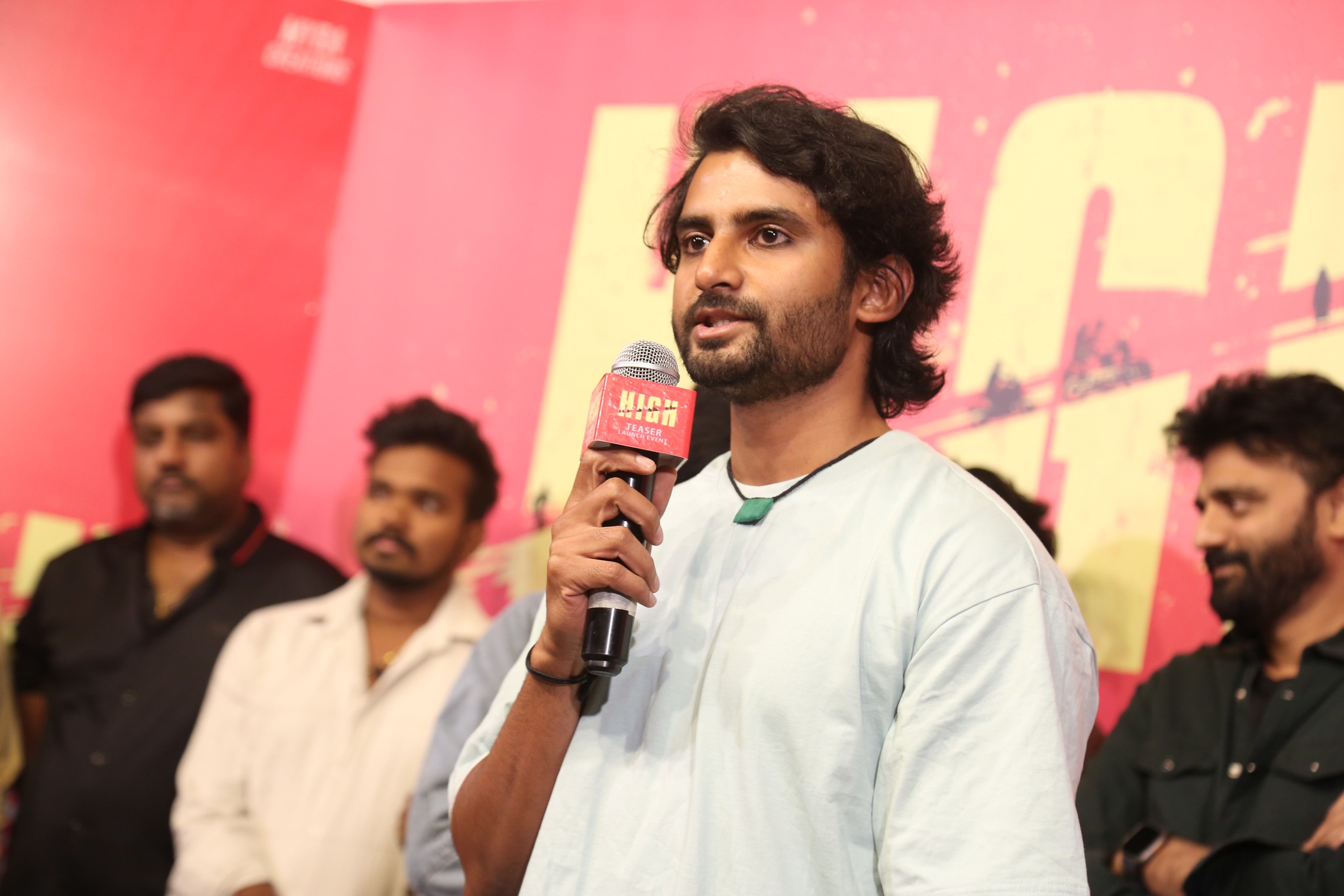 Sai Krishna giving speech on stage