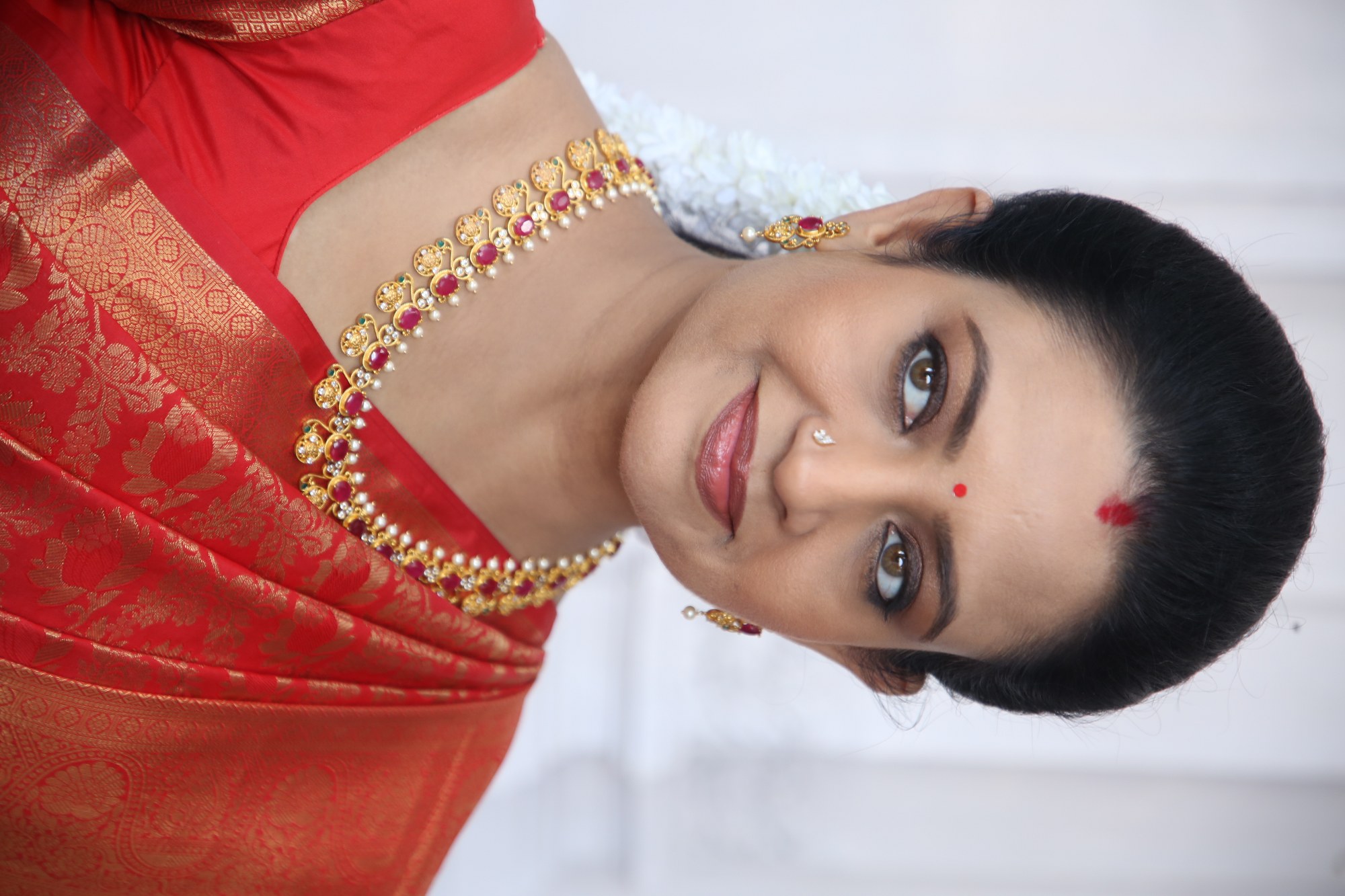 Indraja shining in red gold style