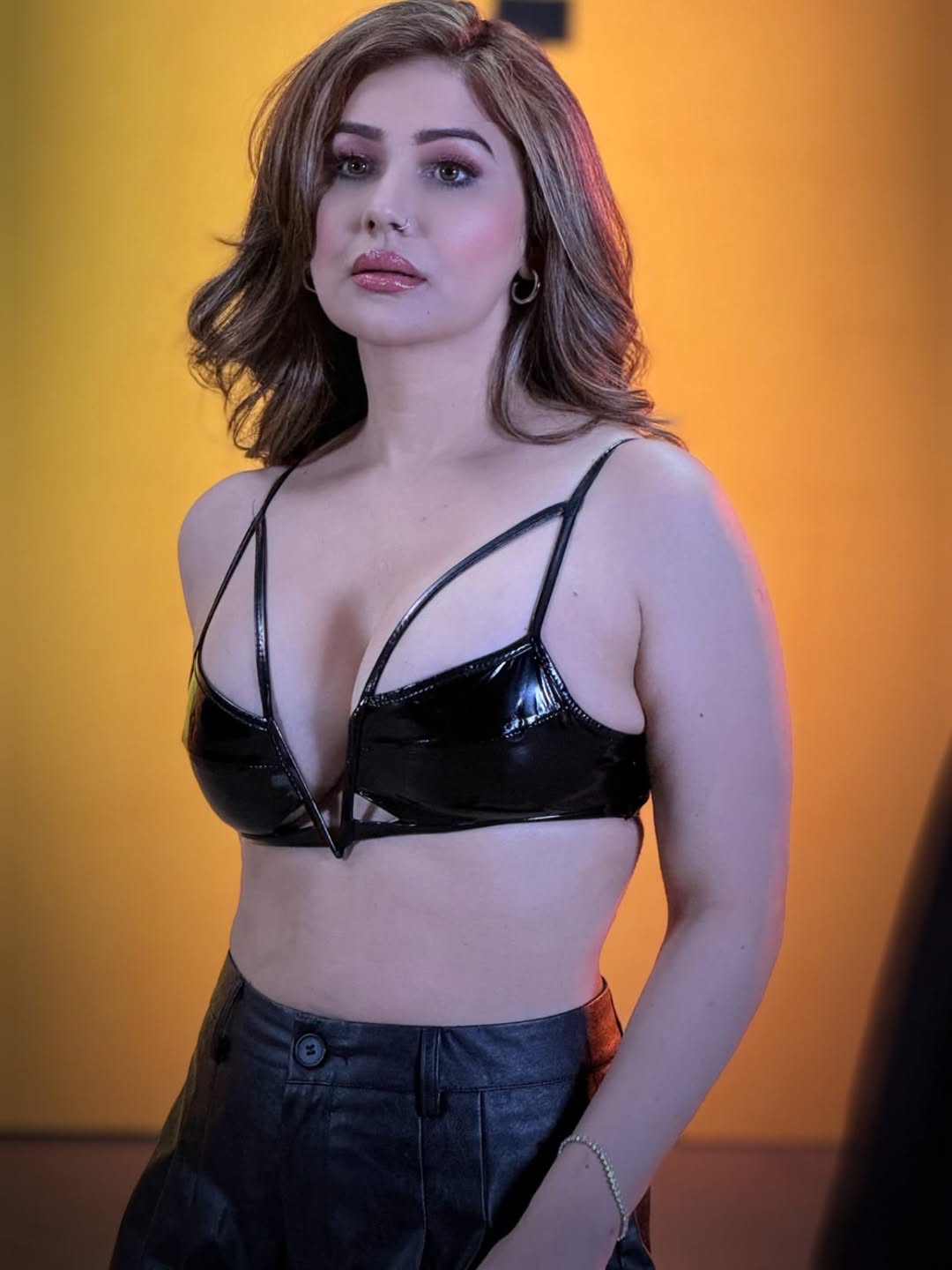 Kangna Sharma confident pose in patent black fashion