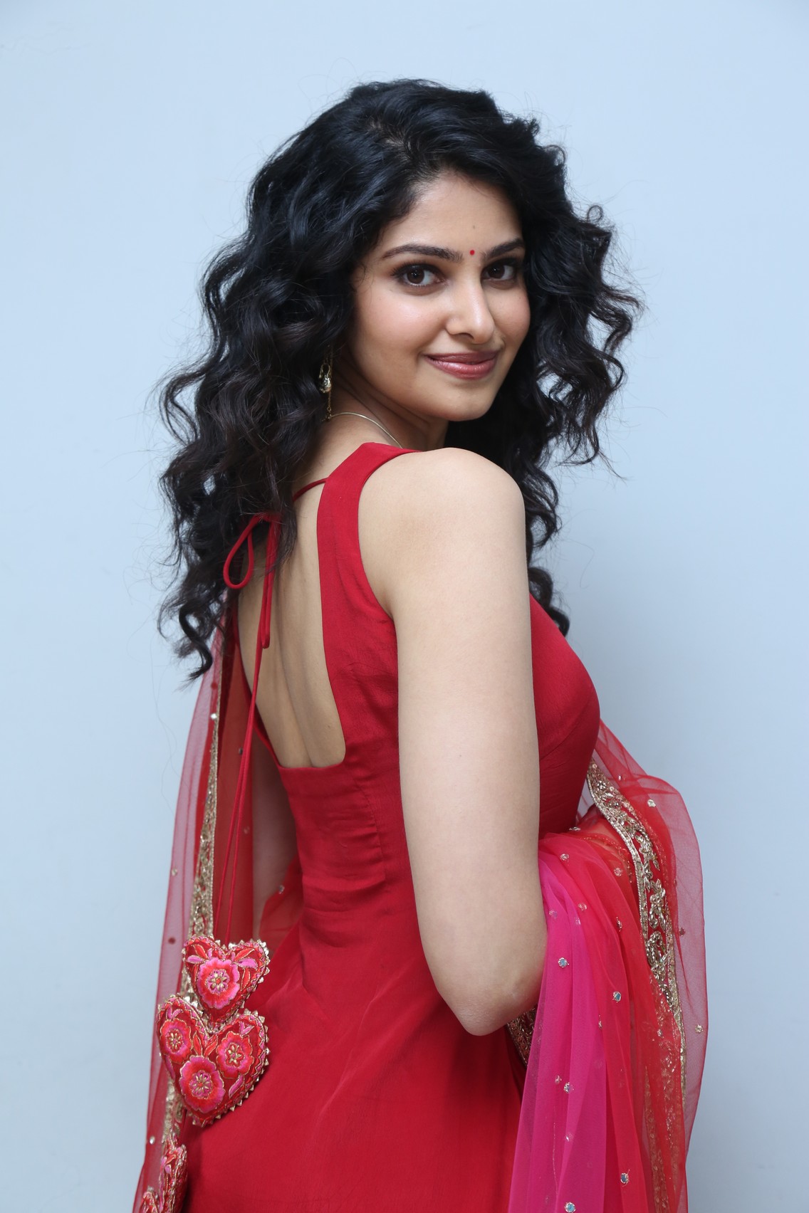 Manasa Varanasi confident pose in red attire