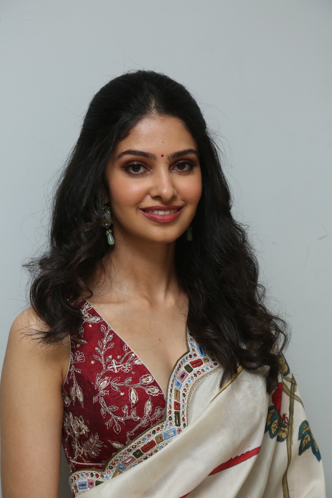 Manasa Varanasi smiling in elegant saree