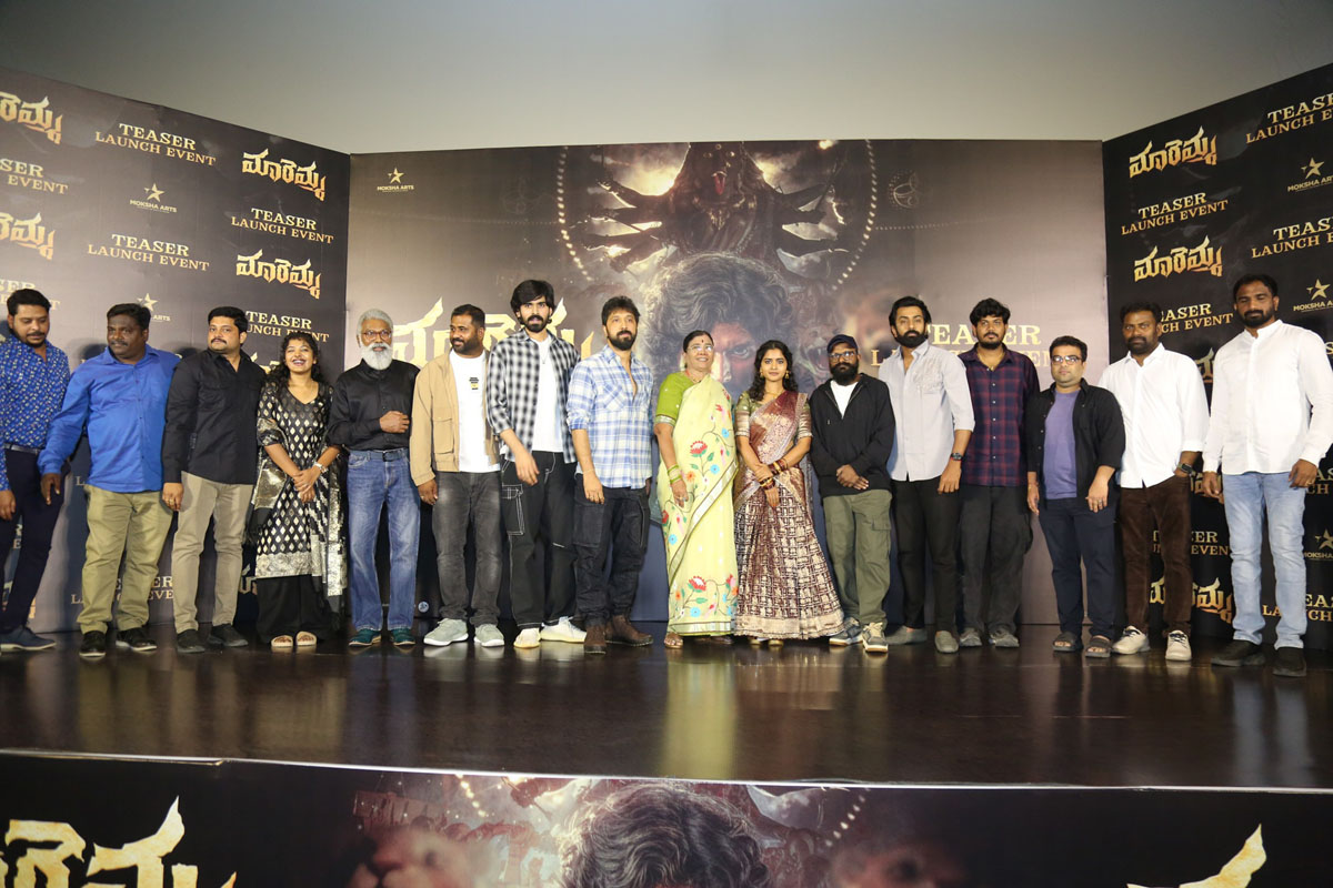 Maremma film team posing together on stage