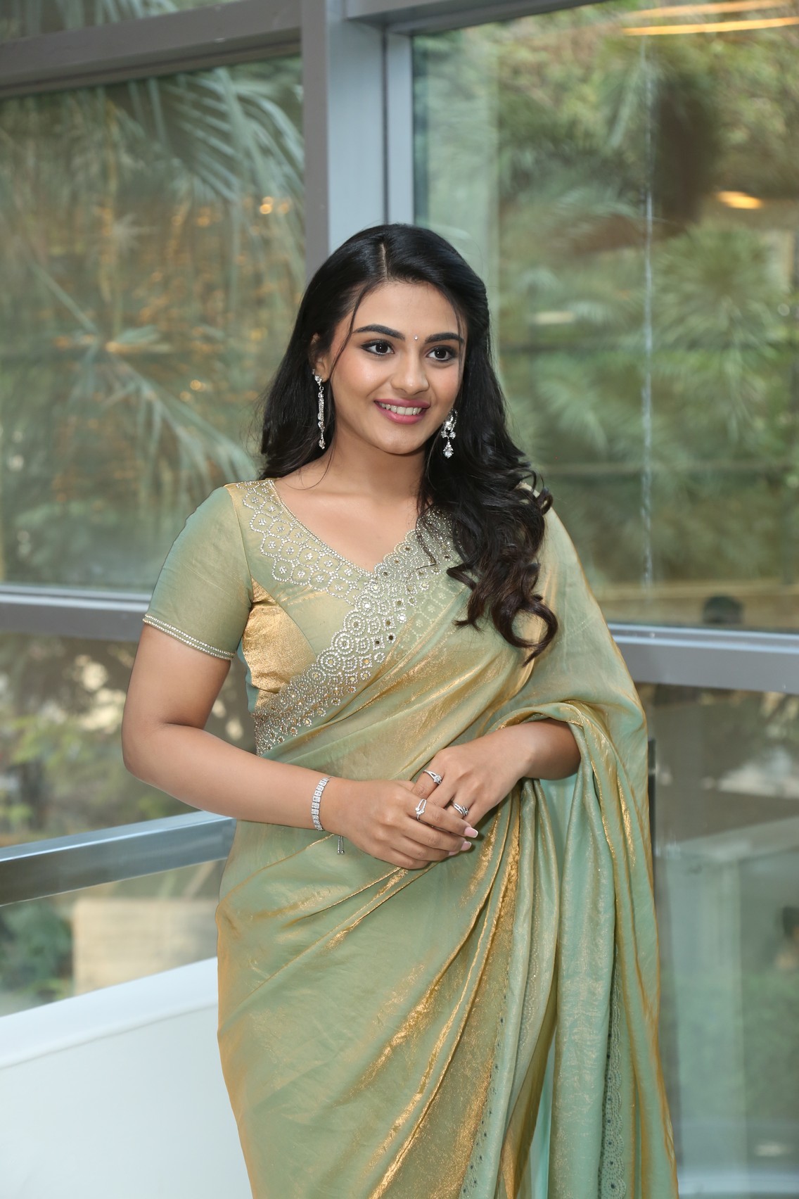 Nayan Sarika gold green saree elegance