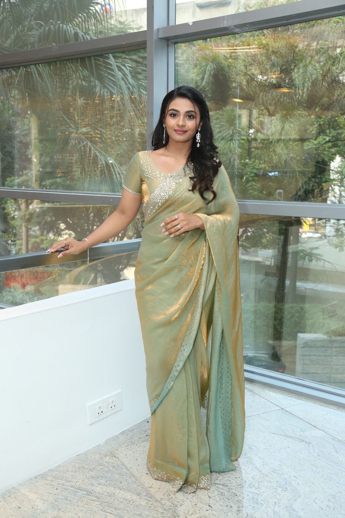 Nayan Sarika graceful gold saree look