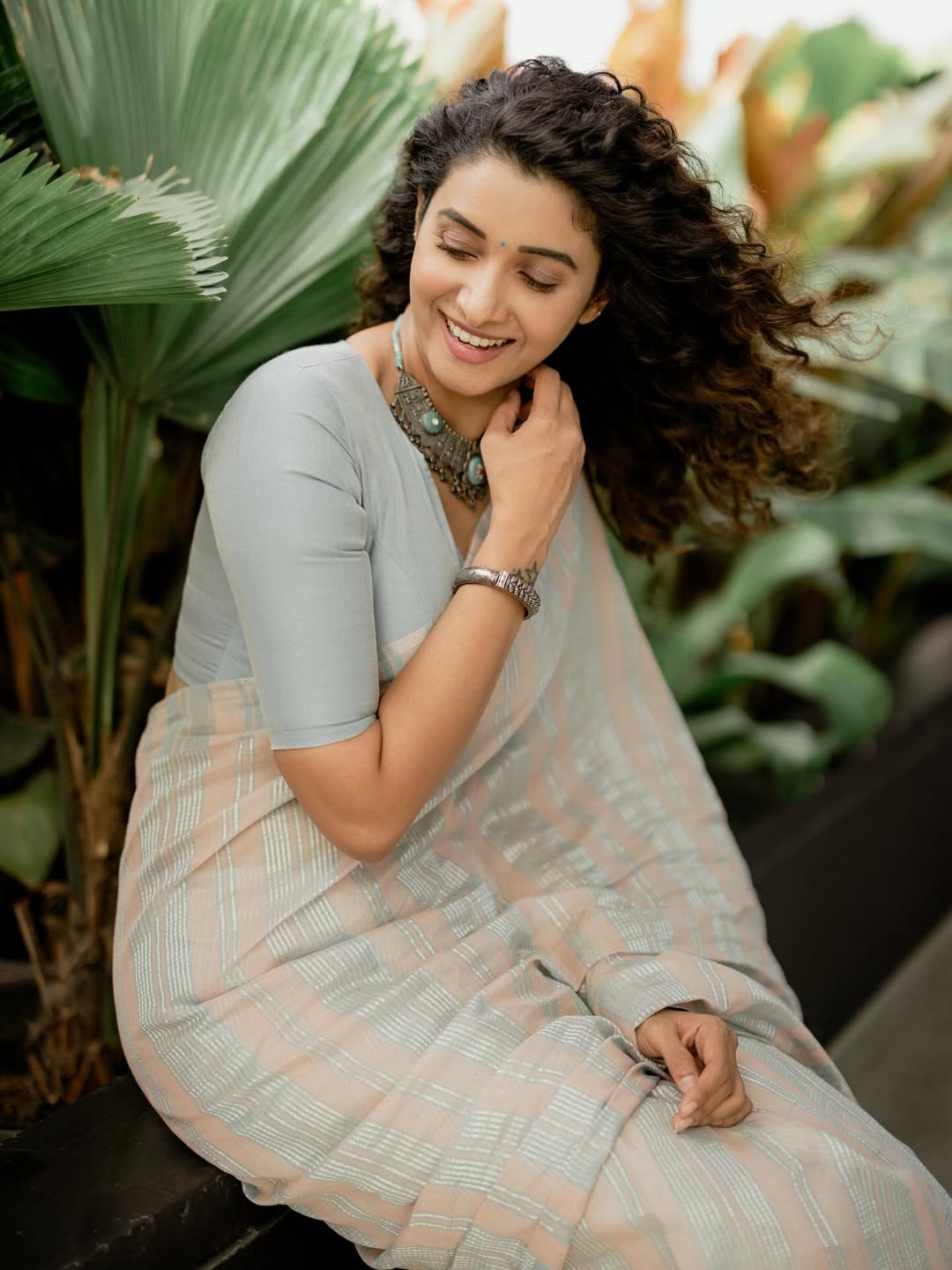 Priya serene in saree garden backdrop
