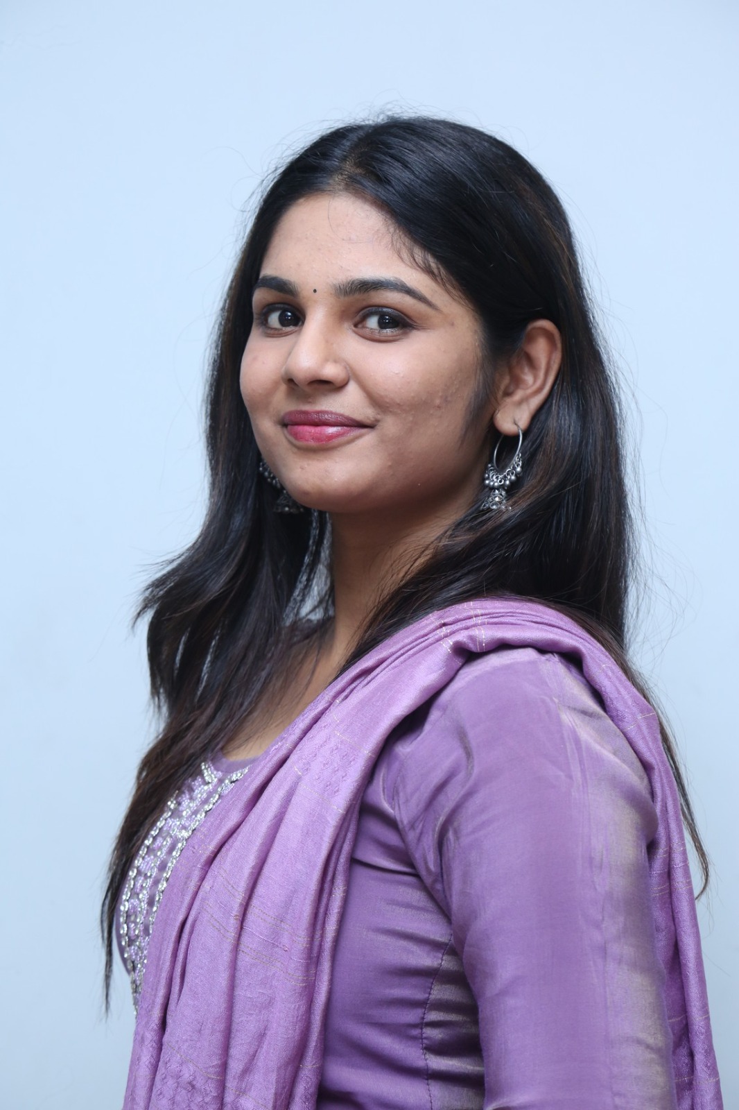 RK Dhanusha regal purple ensemble graceful pose