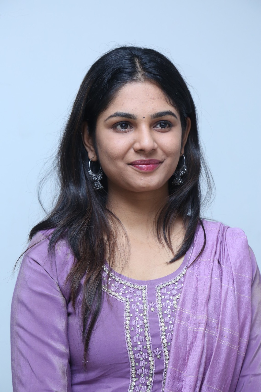 RK Dhanusha stylish purple dress confident look