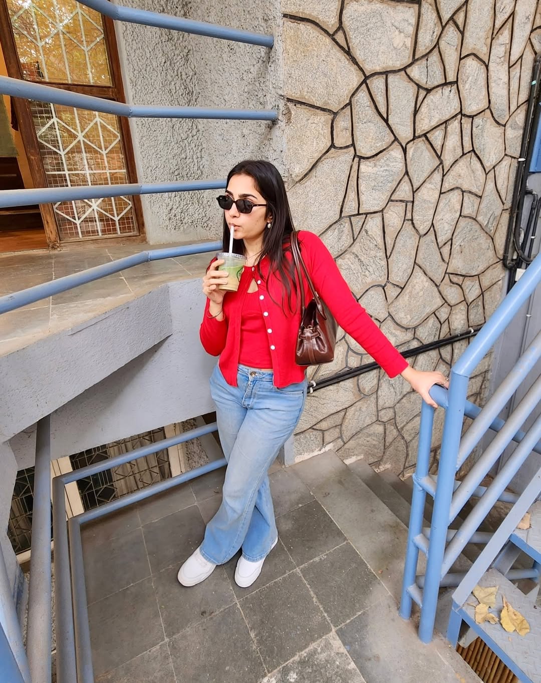 Rukmini Vasanth vintage red cardigan runway vibe